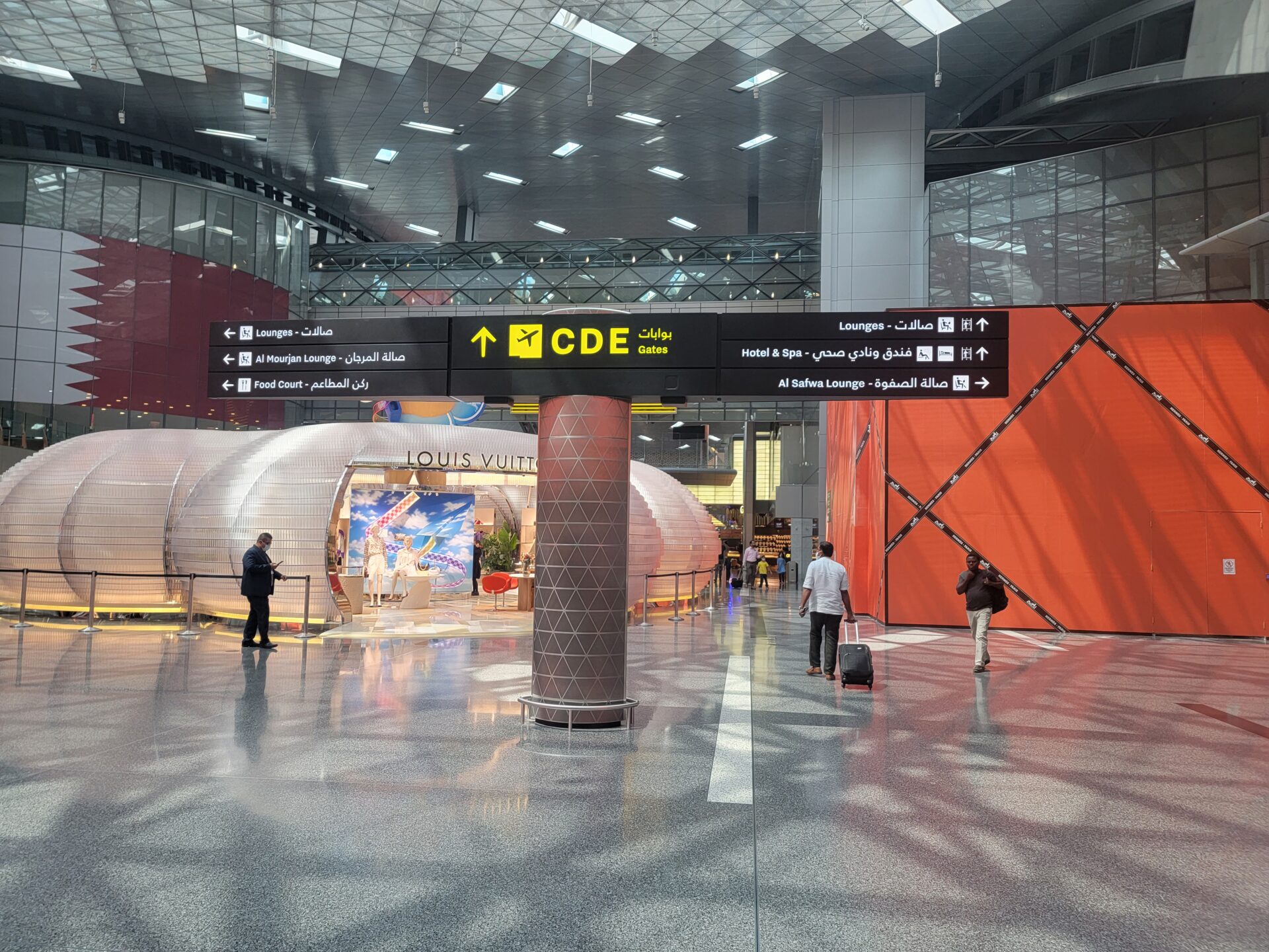 people walking in a large airport