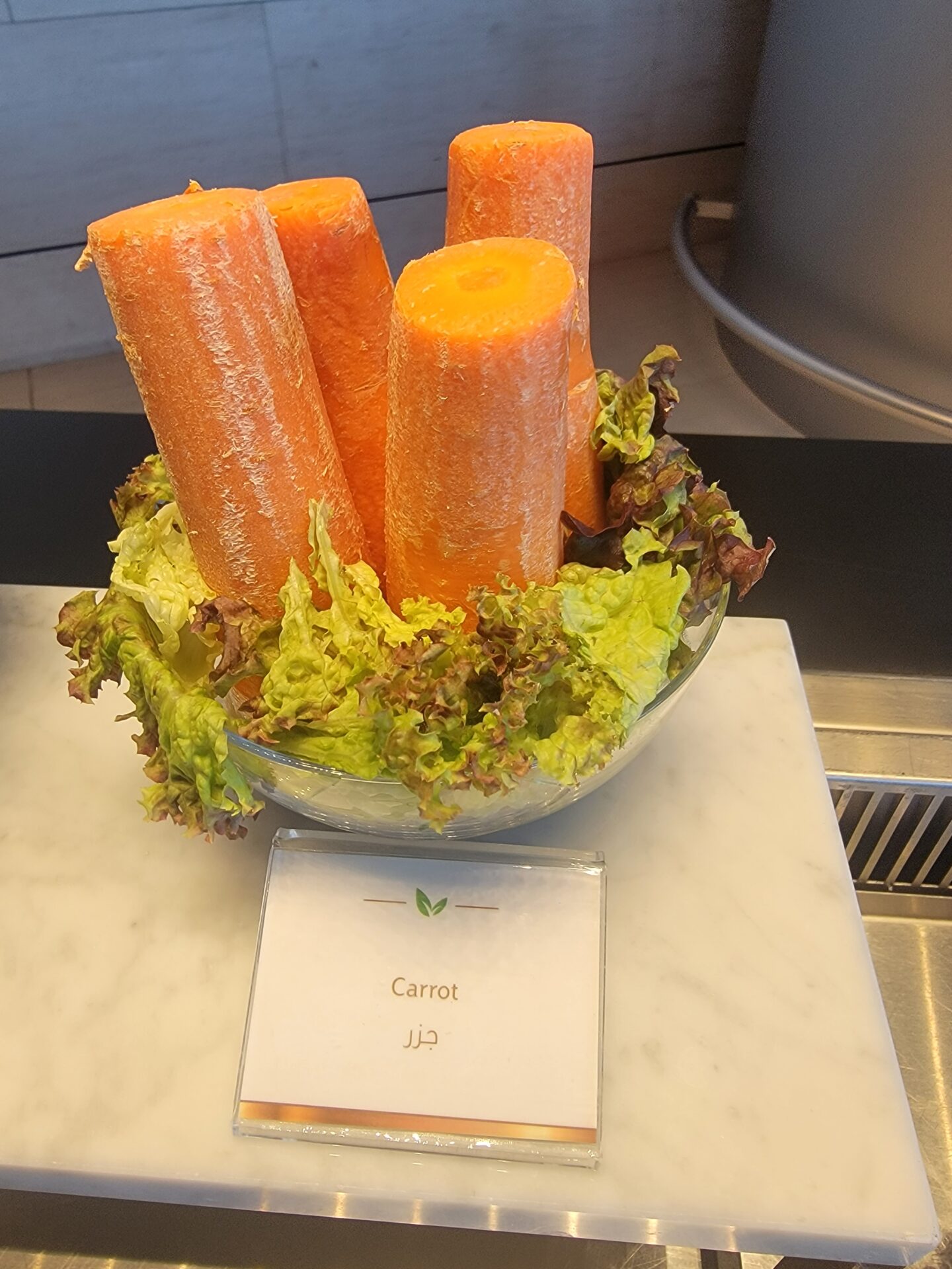 a bowl of carrots and lettuce