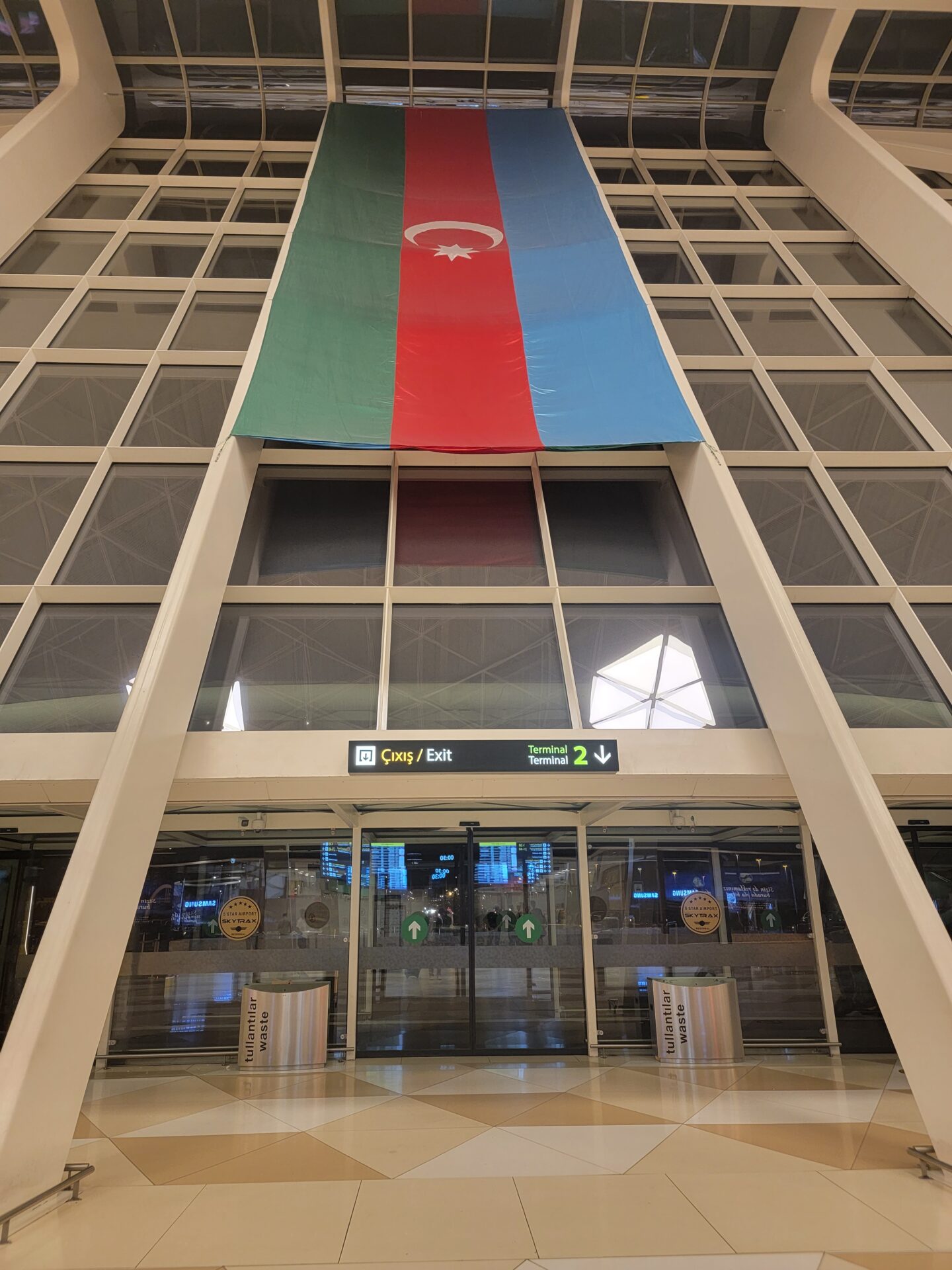 a large flag from a glass wall