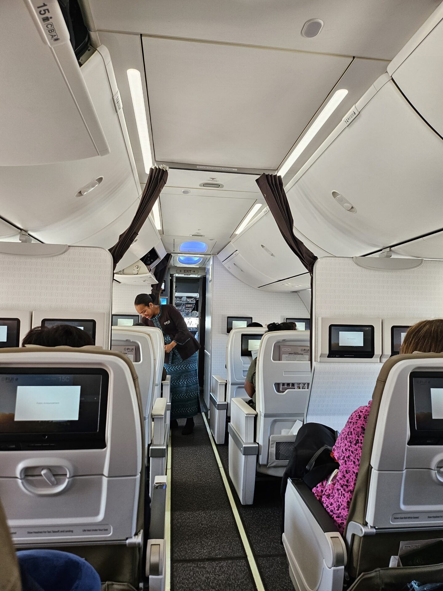 a group of people sitting in an airplane