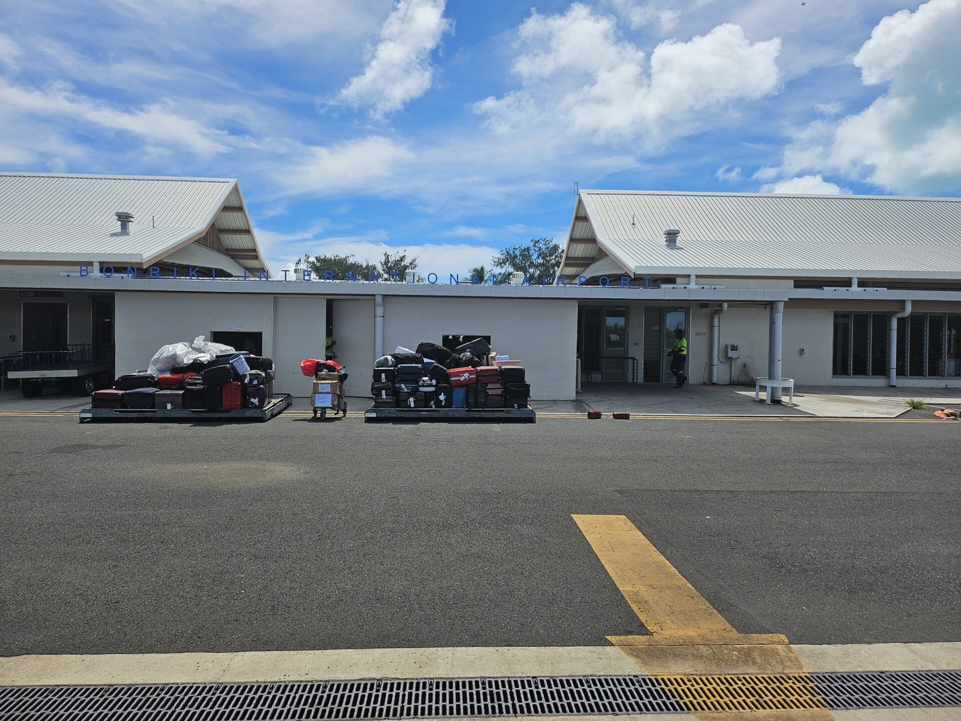 a building with luggage on carts