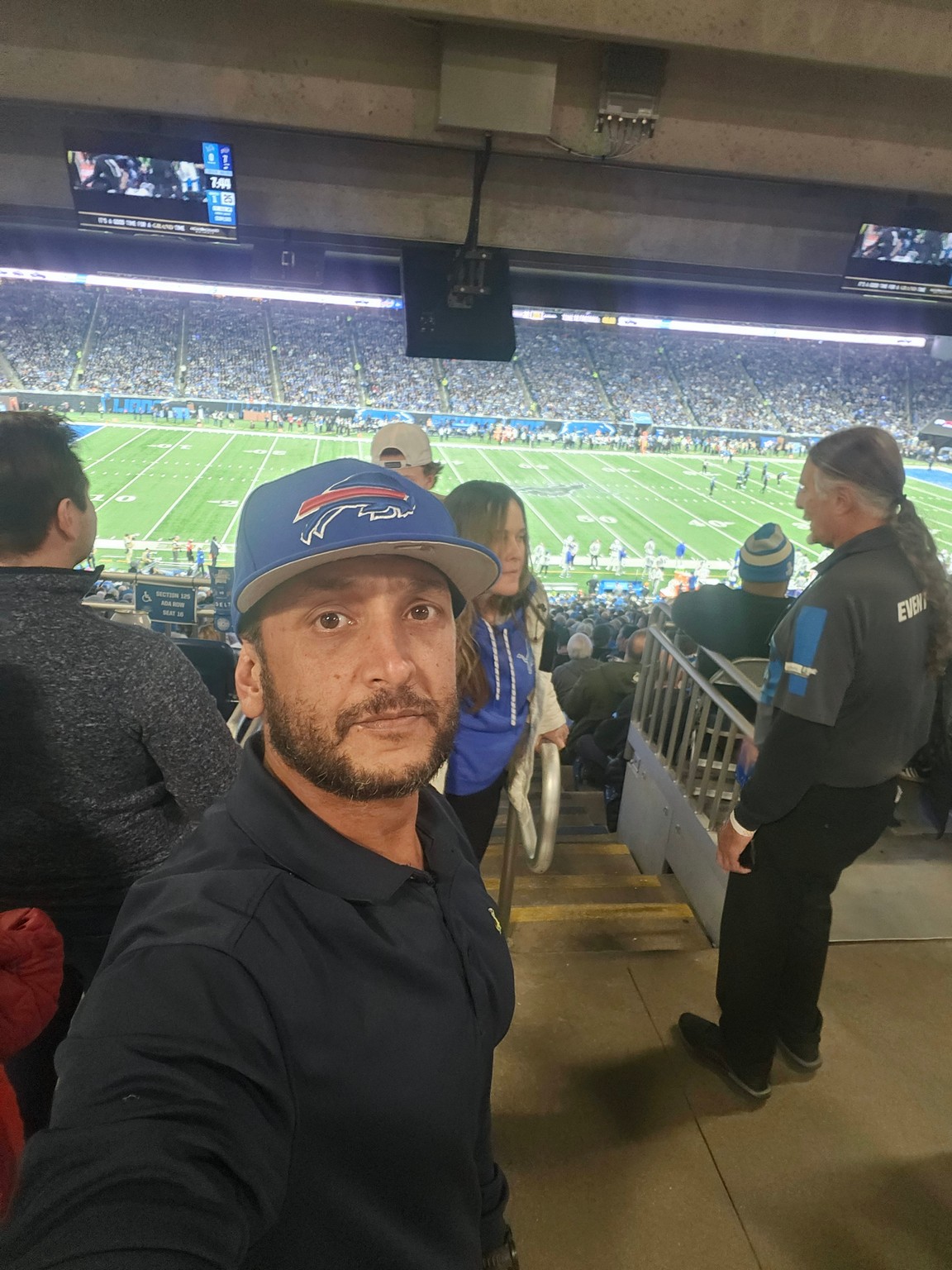 a man taking a selfie in a stadium