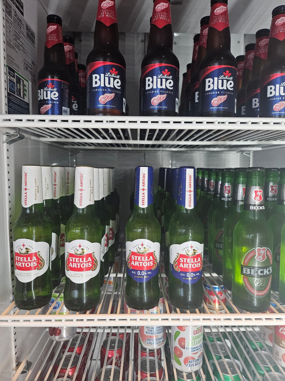 a refrigerator full of beer bottles