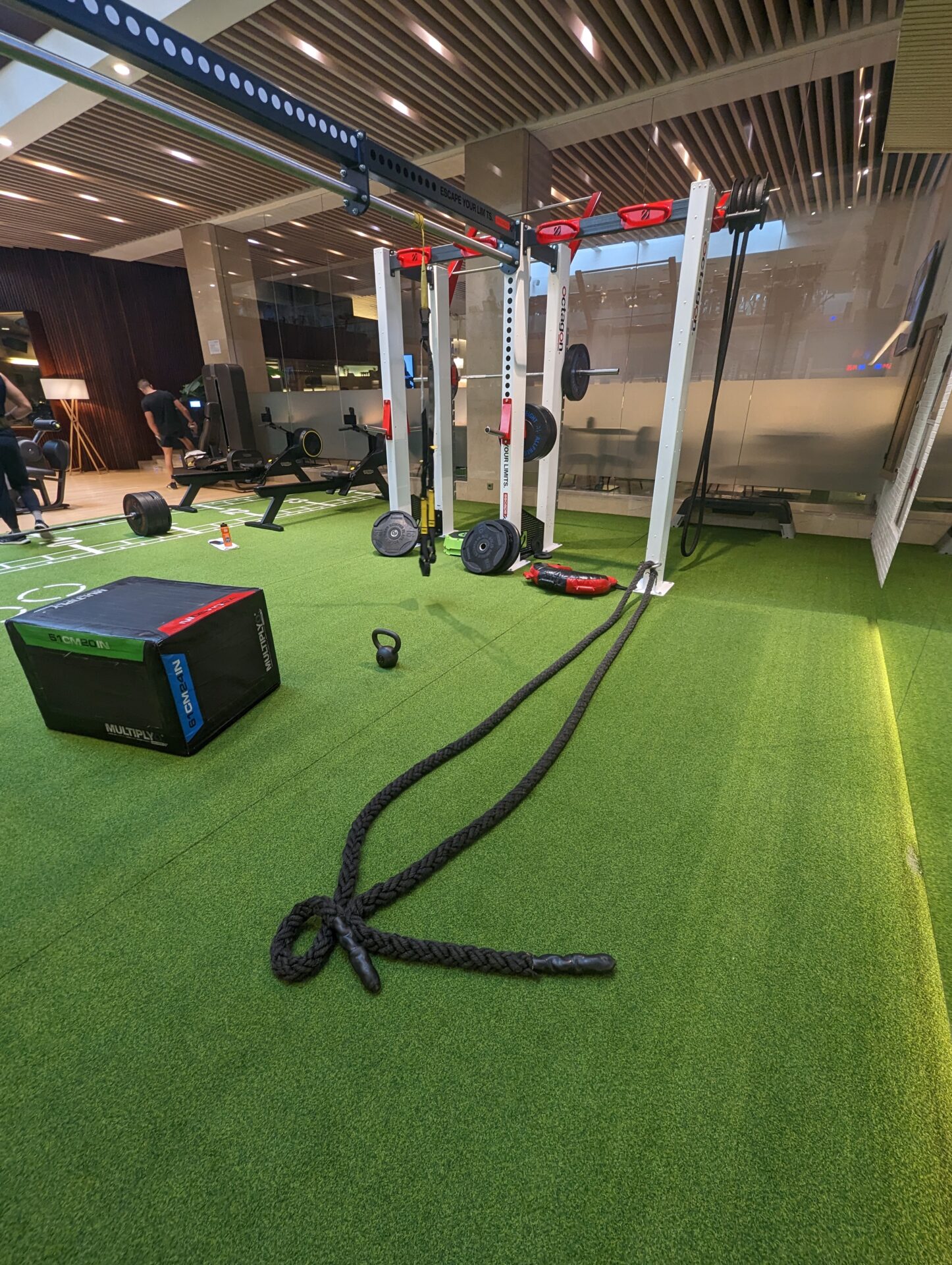 a gym with a rope and weights