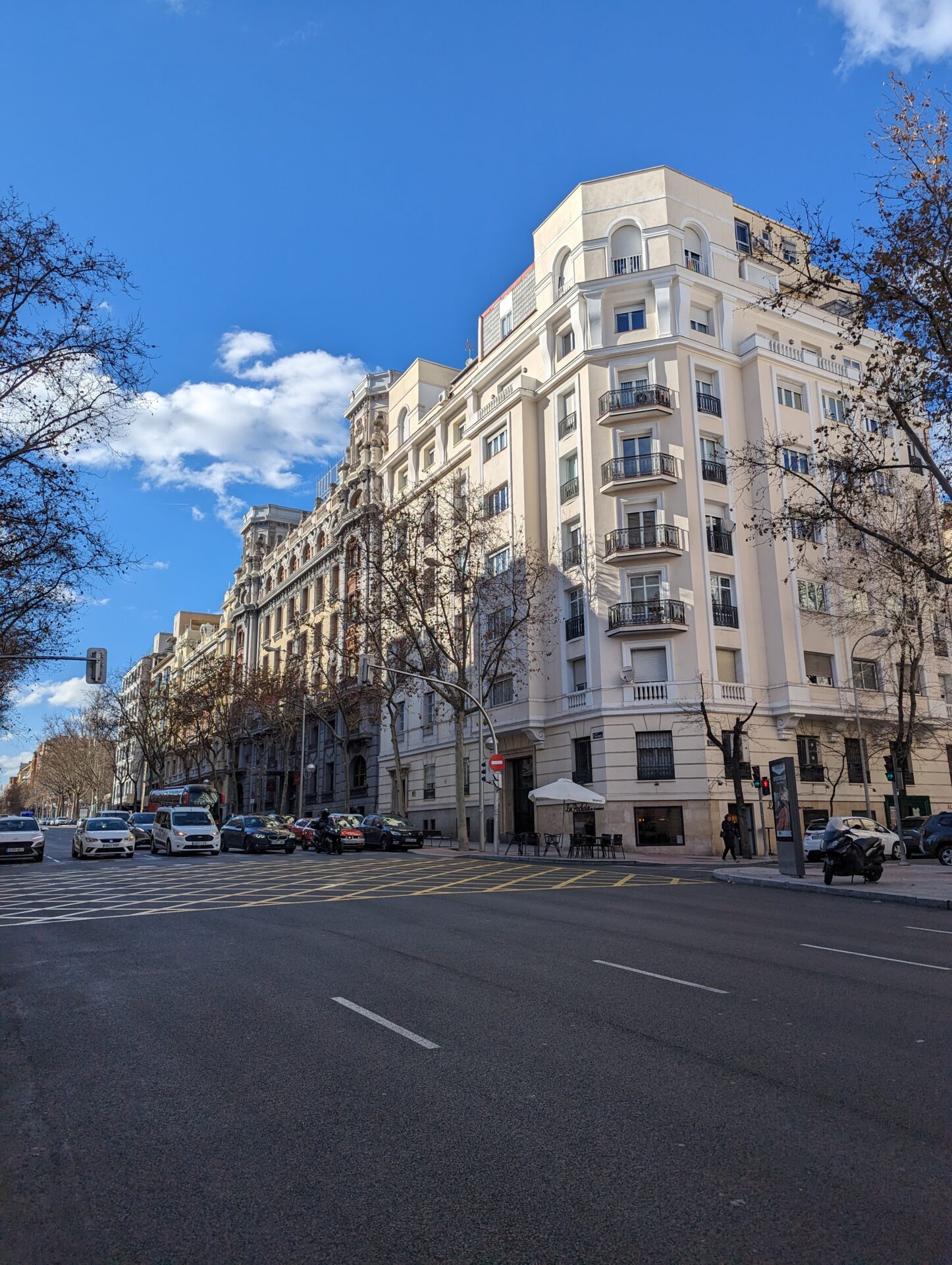 a street with cars and buildings