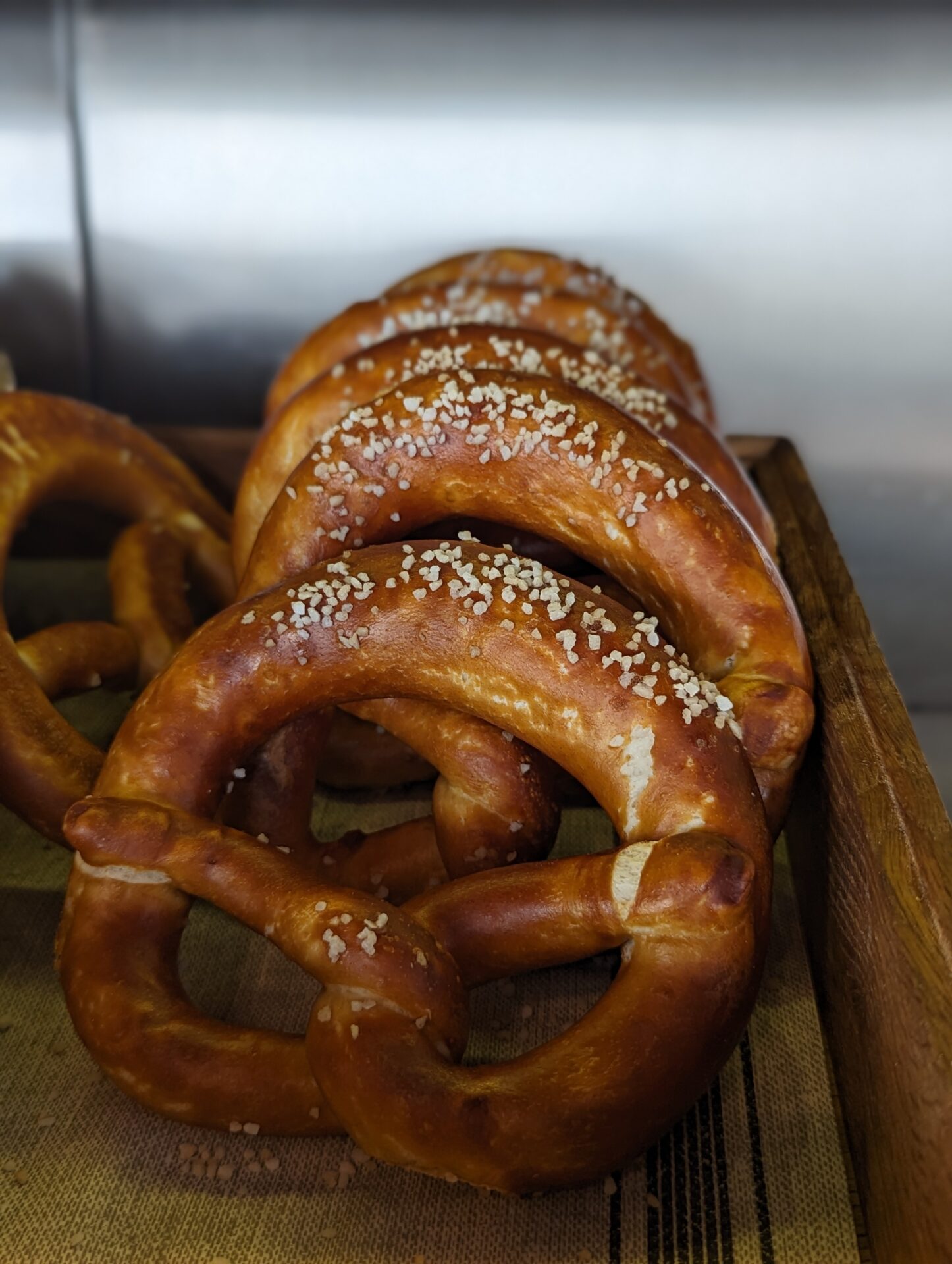 a group of pretzels in a wooden box