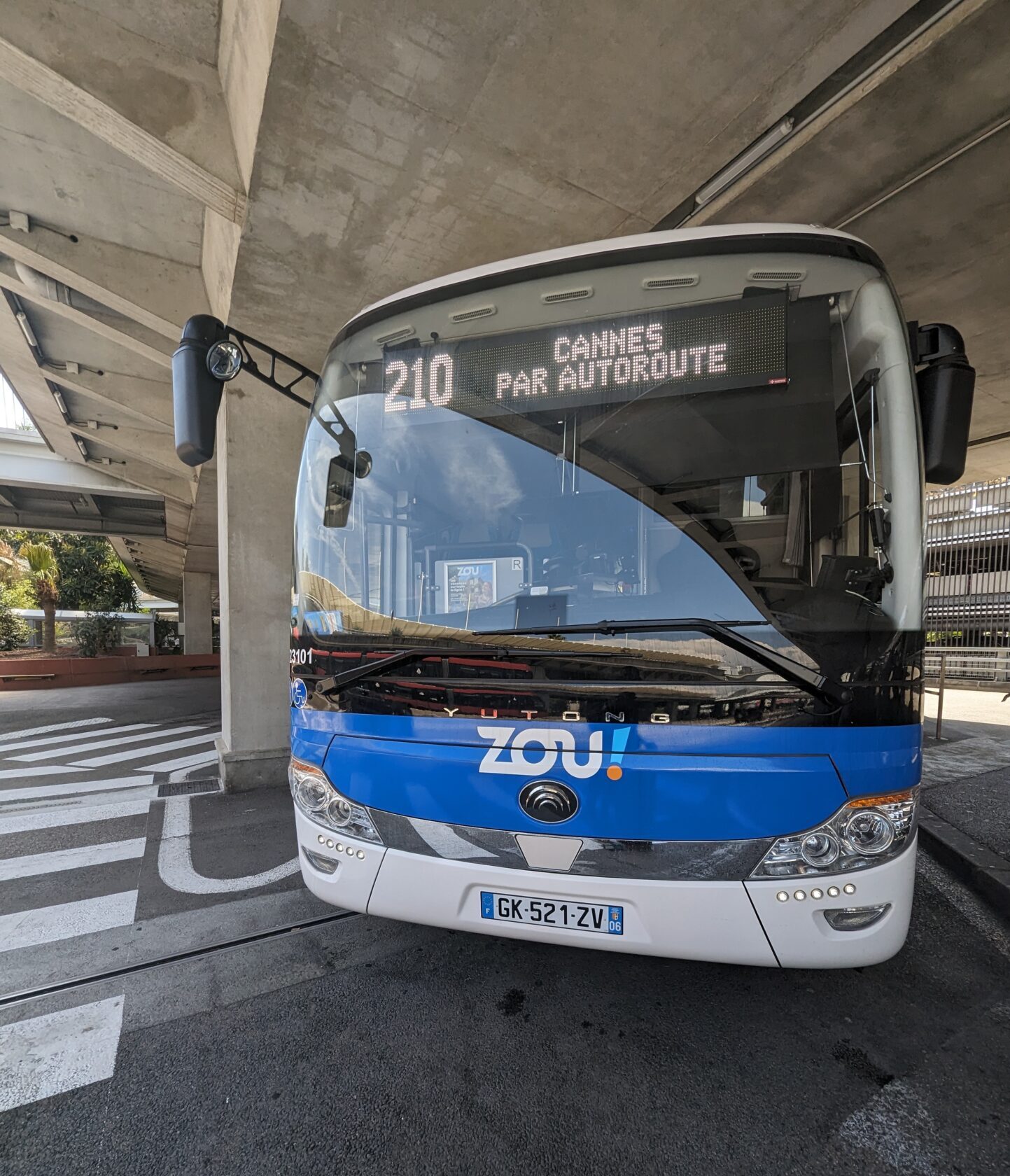 a bus parked under a bridge