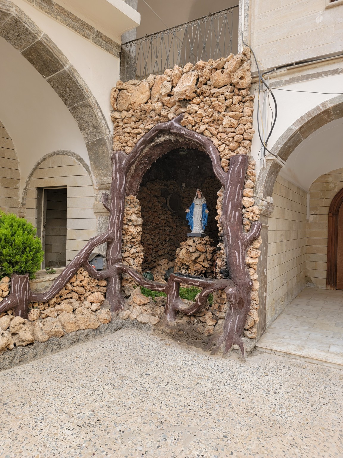 a statue in a stone wall