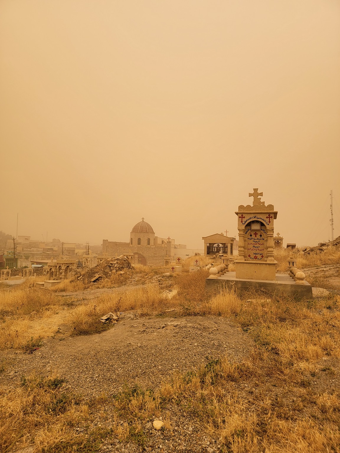 a cemetery in a dry field