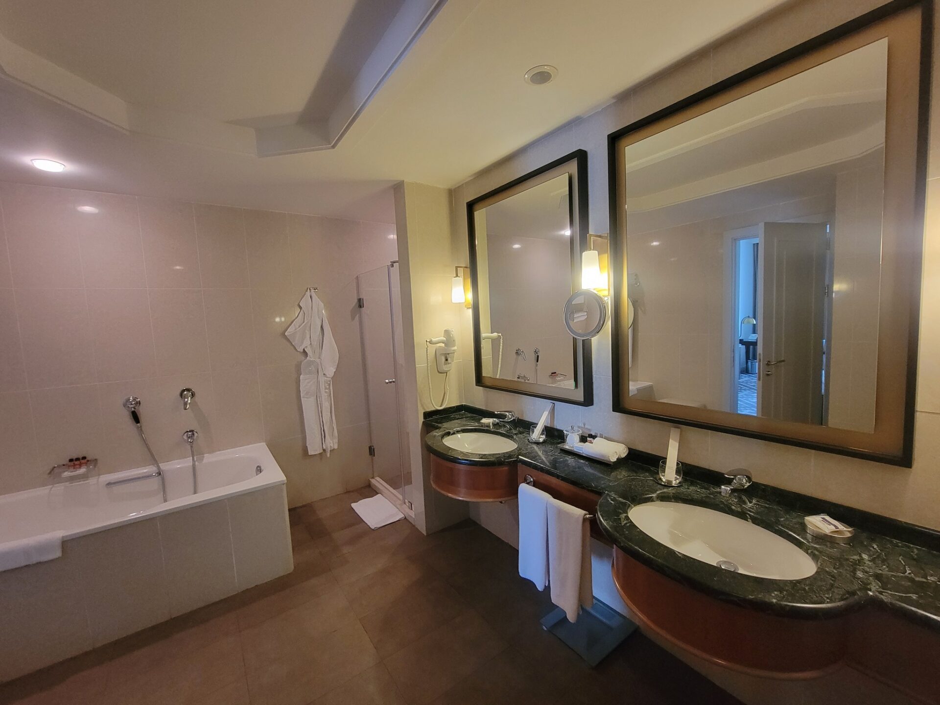 a bathroom with sinks and bathtub