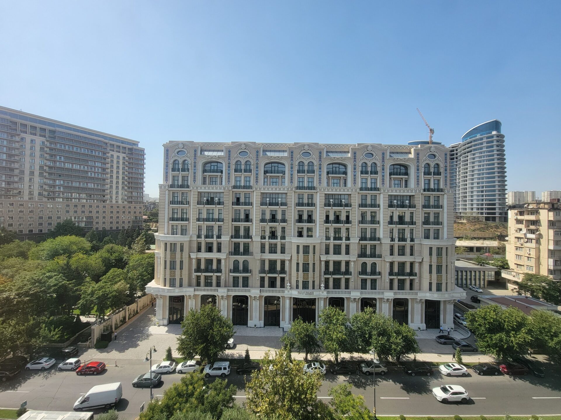 a large building with many windows and a parking lot