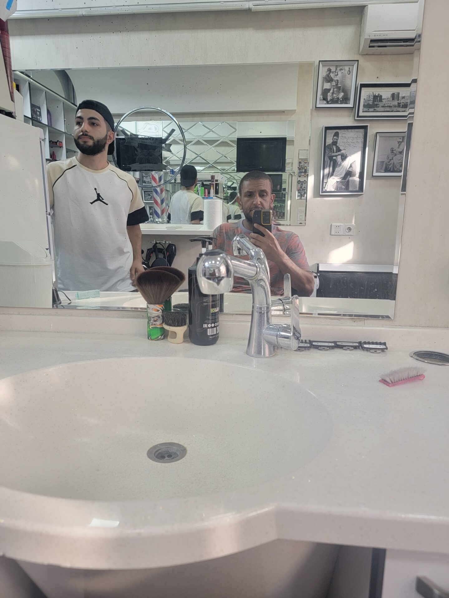 a man standing in front of a sink