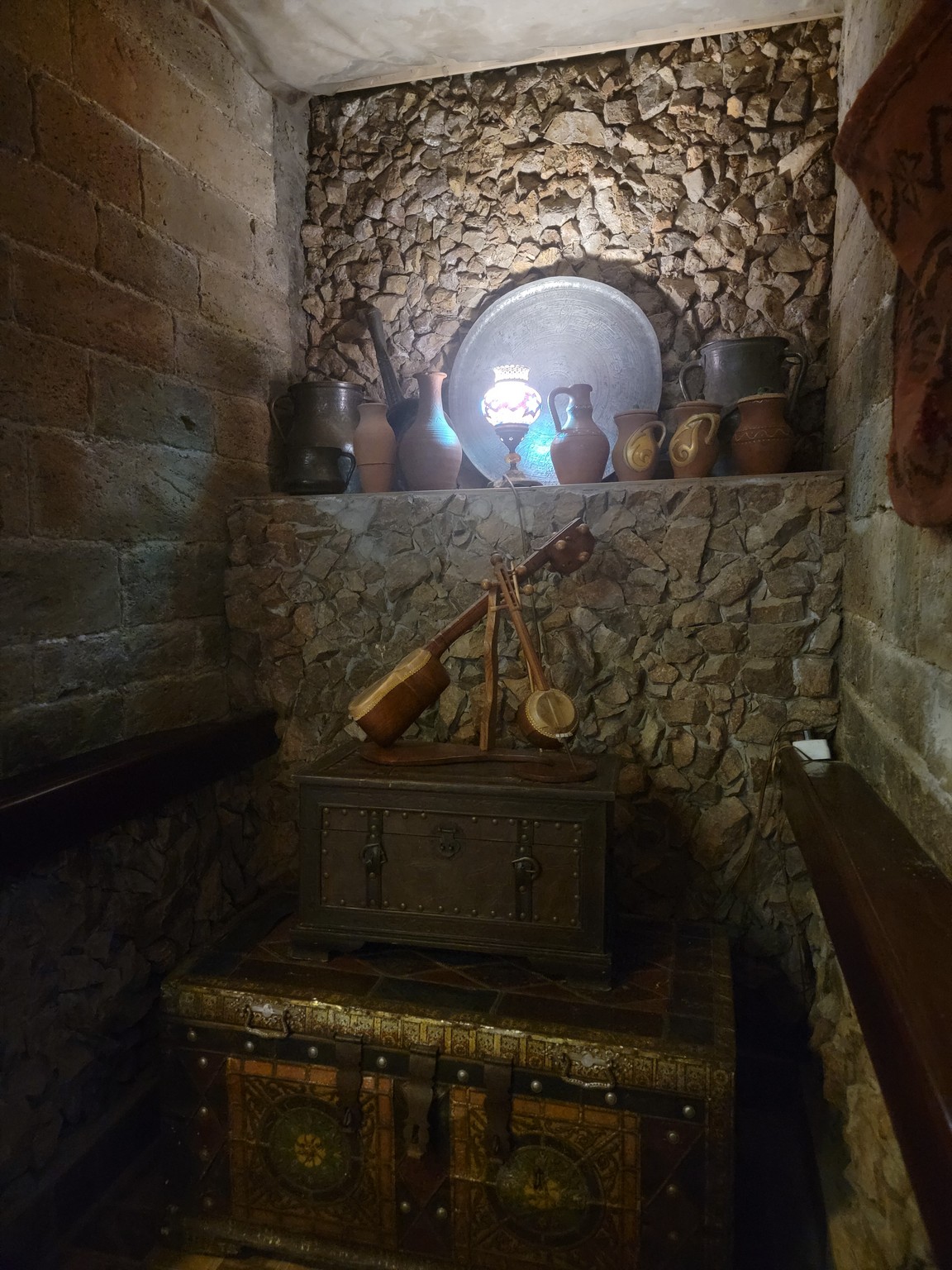 a small chest with a wooden object on it