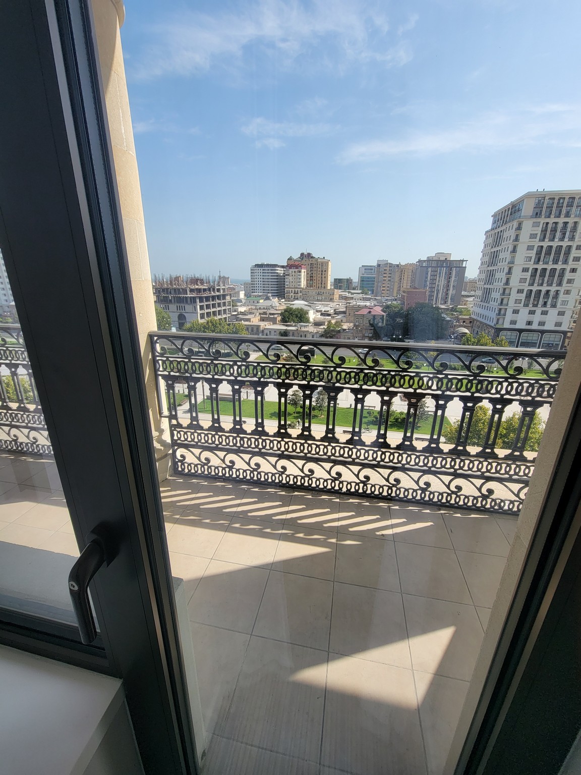 a balcony with a view of a city