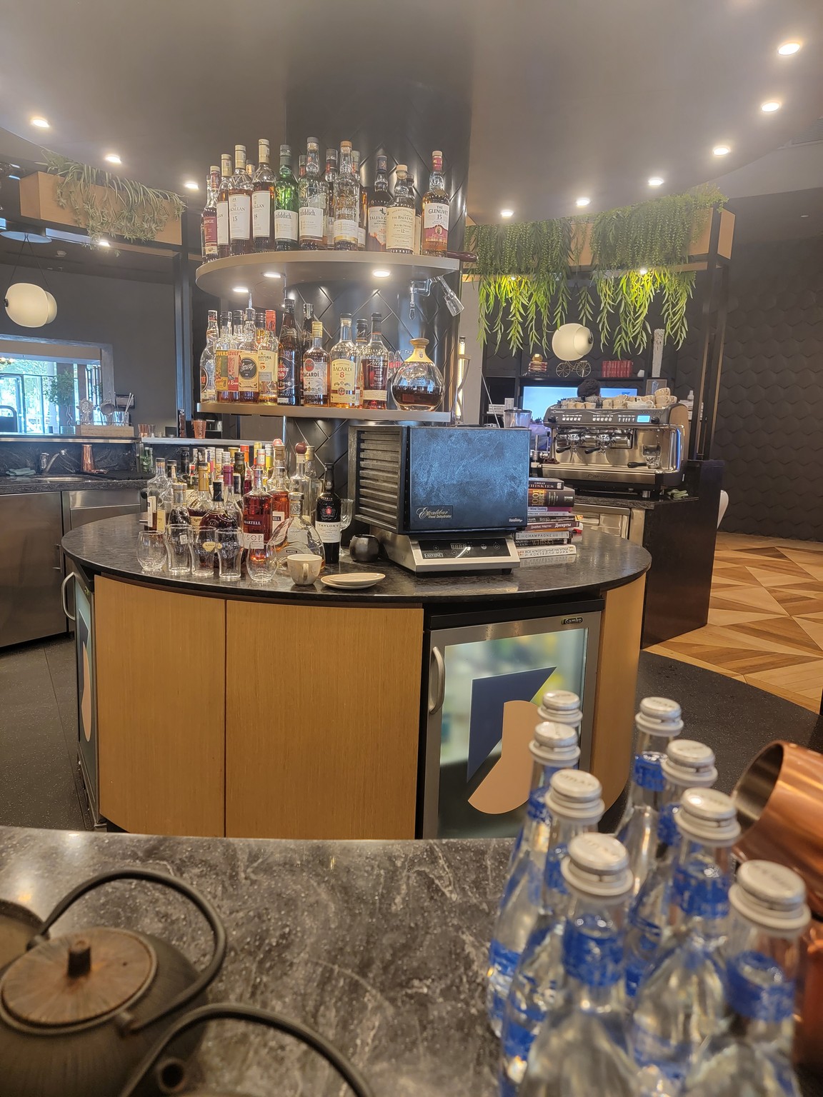 a bar with bottles of alcohol