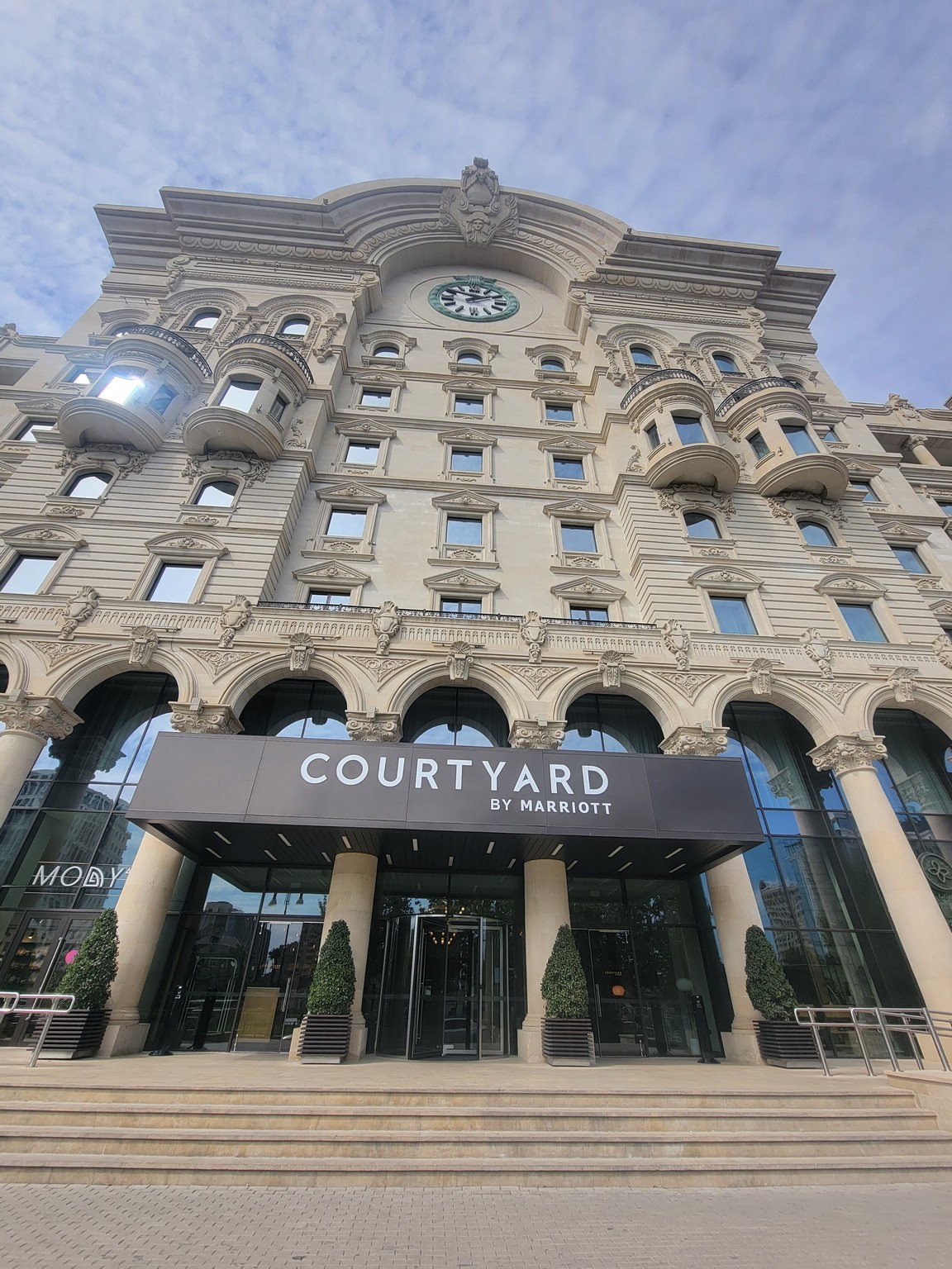 a large building with a clock on the front