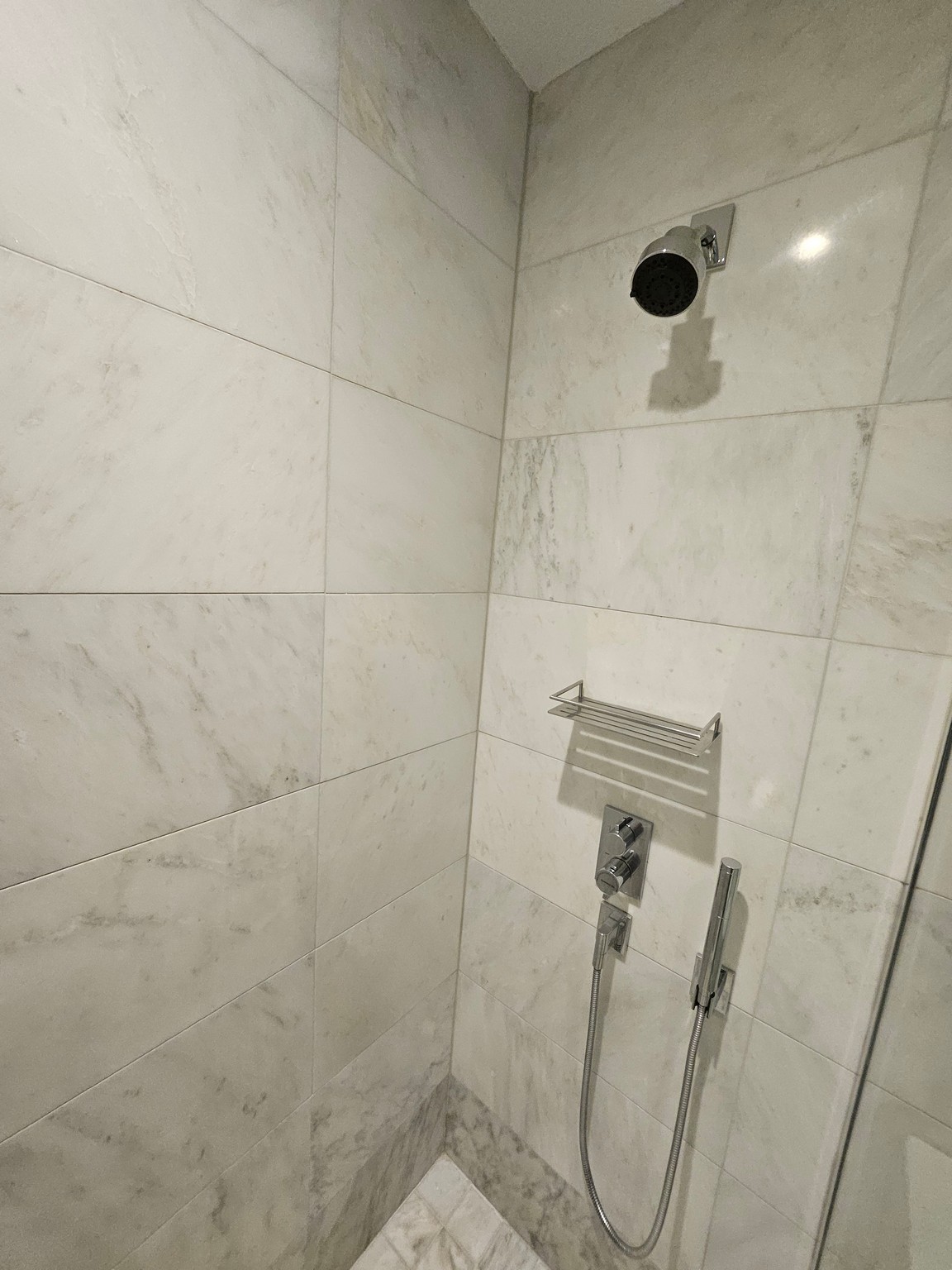 a shower with a shower head