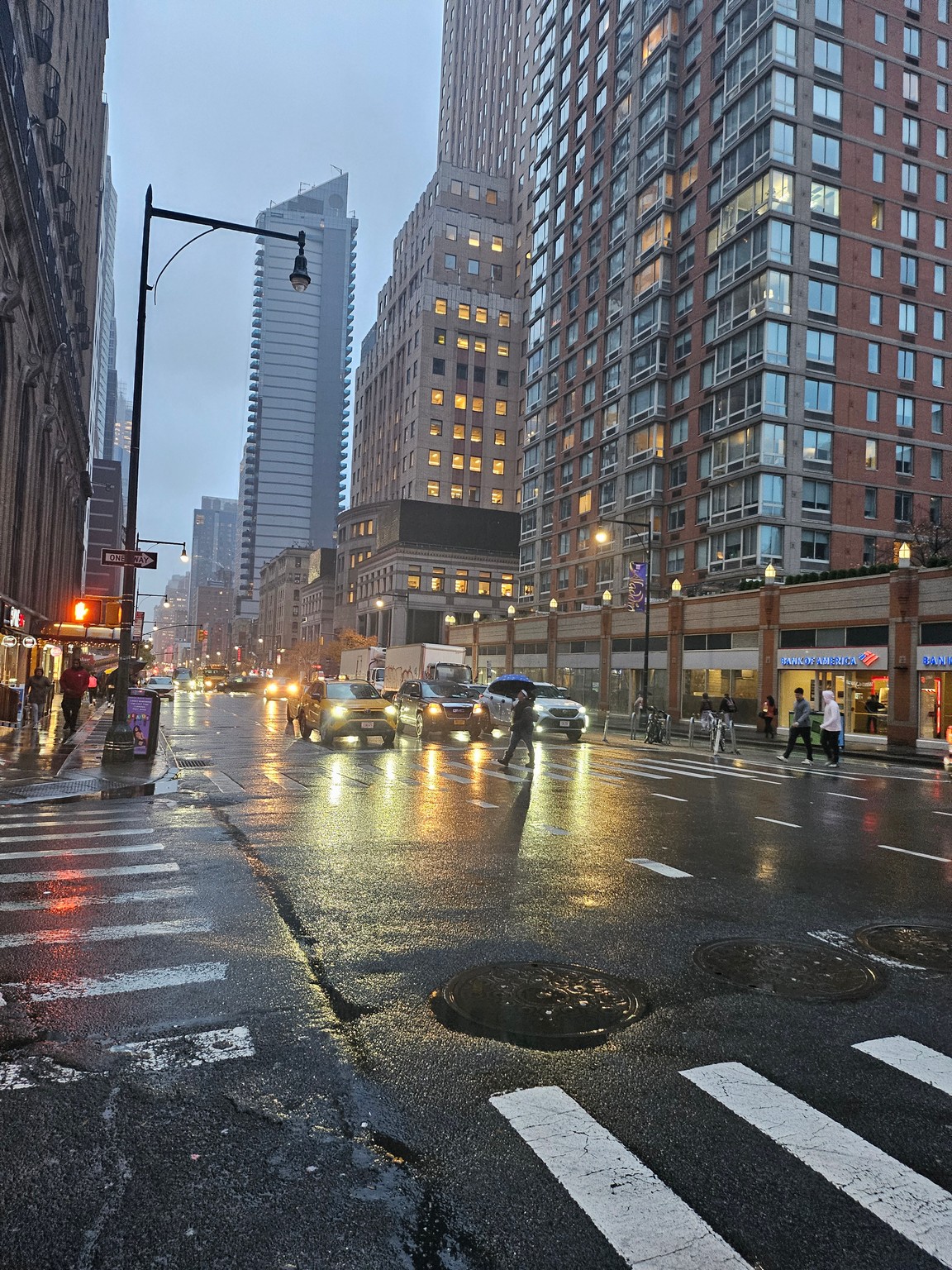 a city street with buildings and cars on it