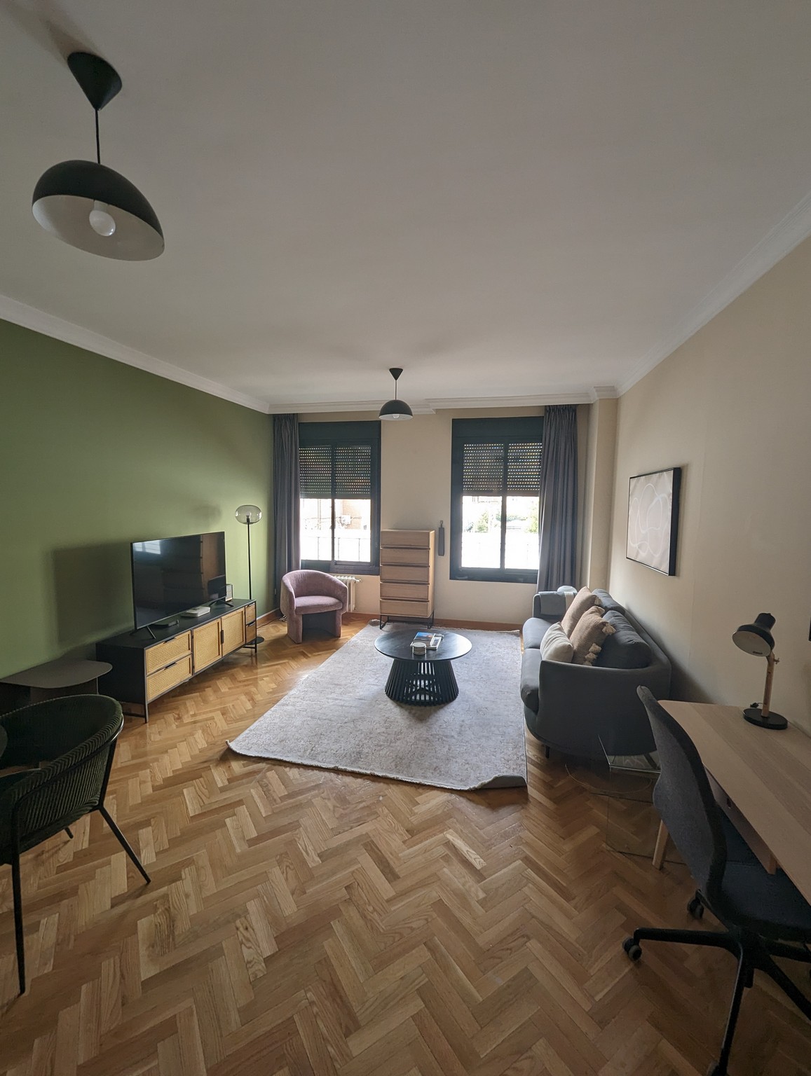 a living room with a tv and a table