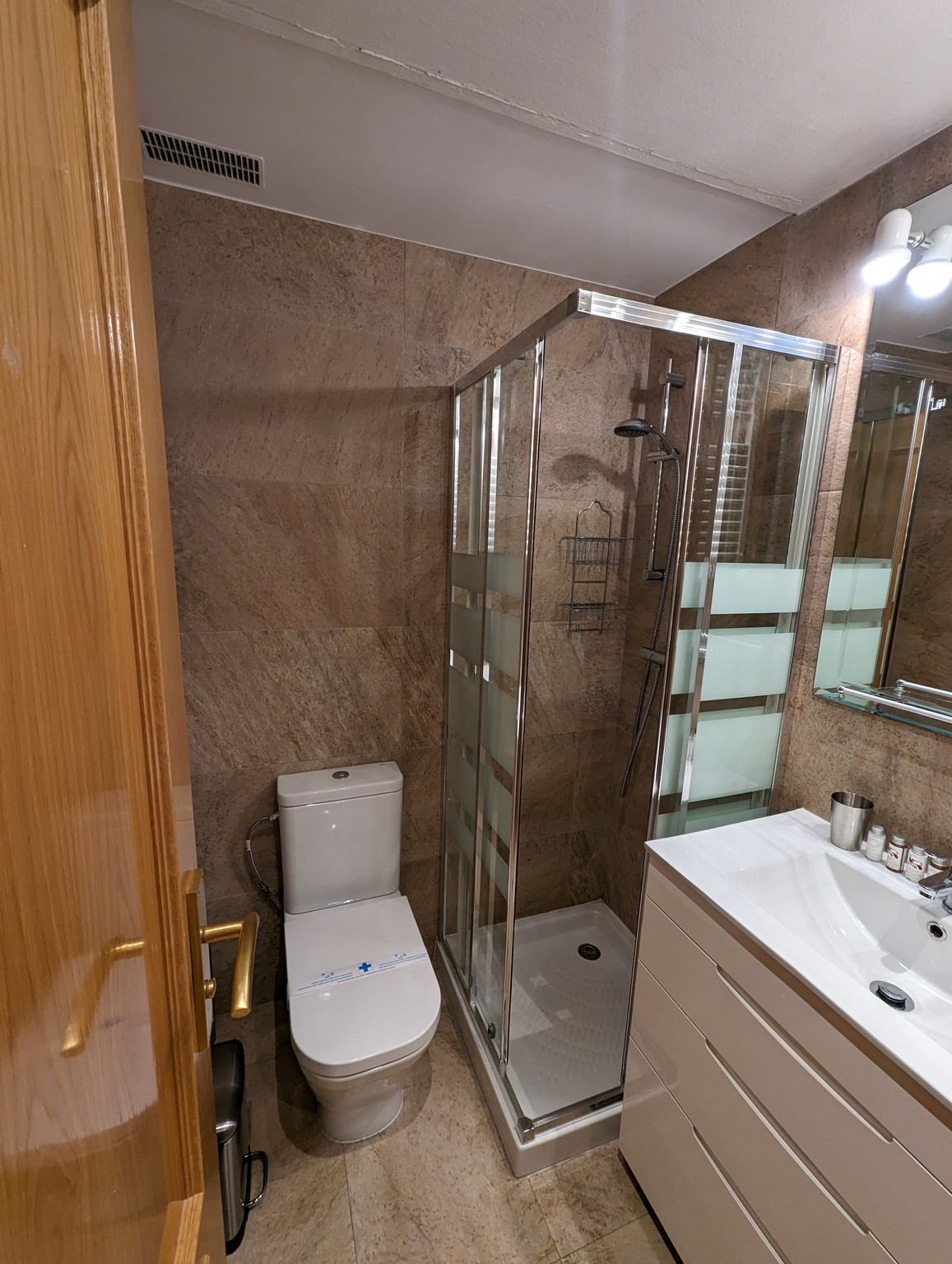 a bathroom with a shower and sink