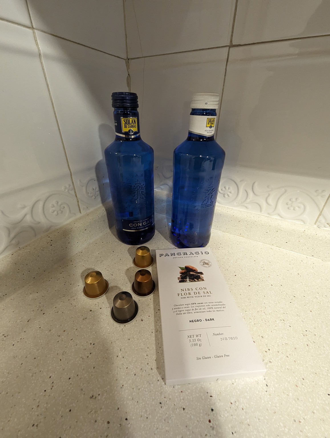 two blue bottles on a counter