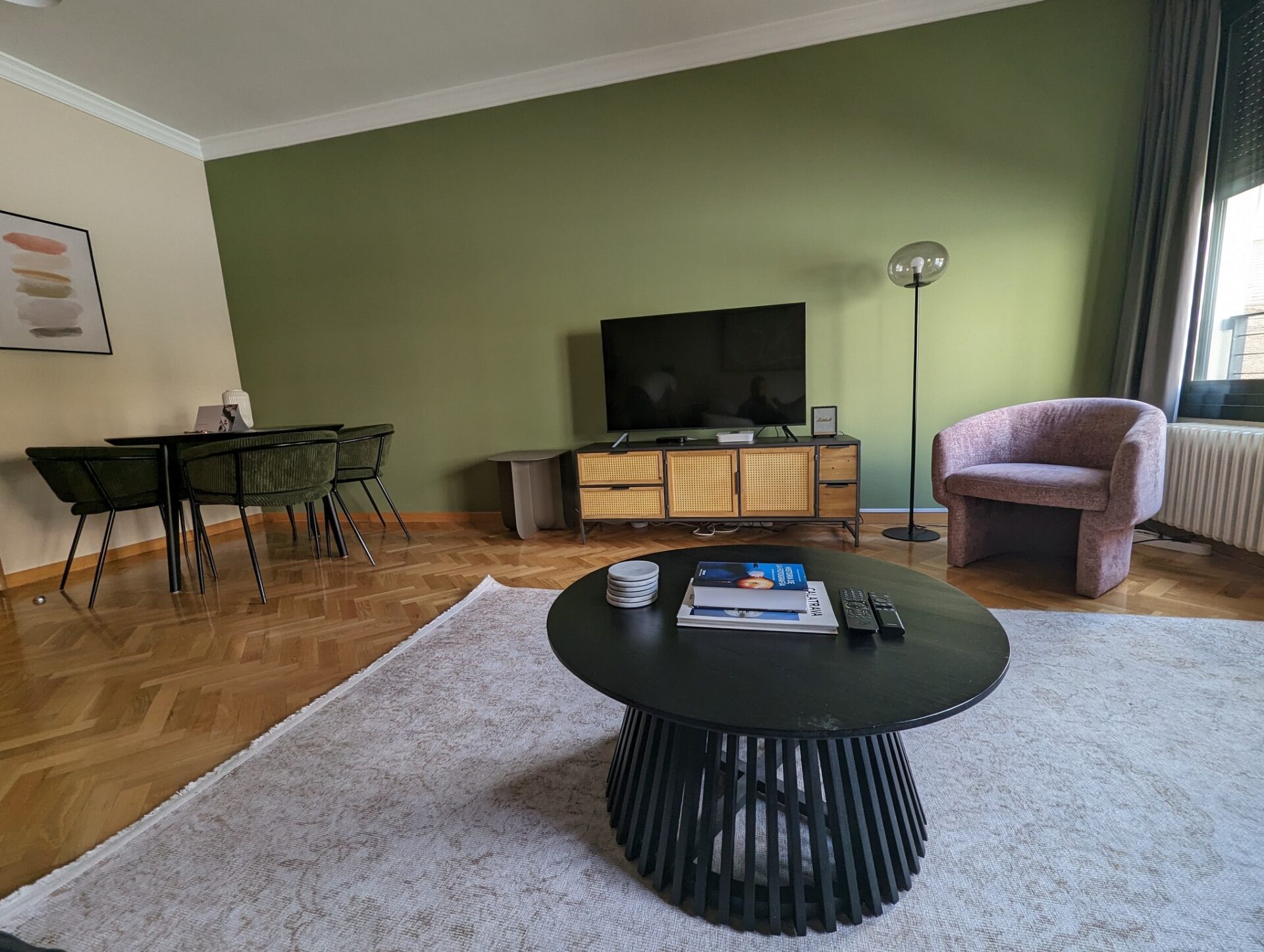 a living room with a television and a table