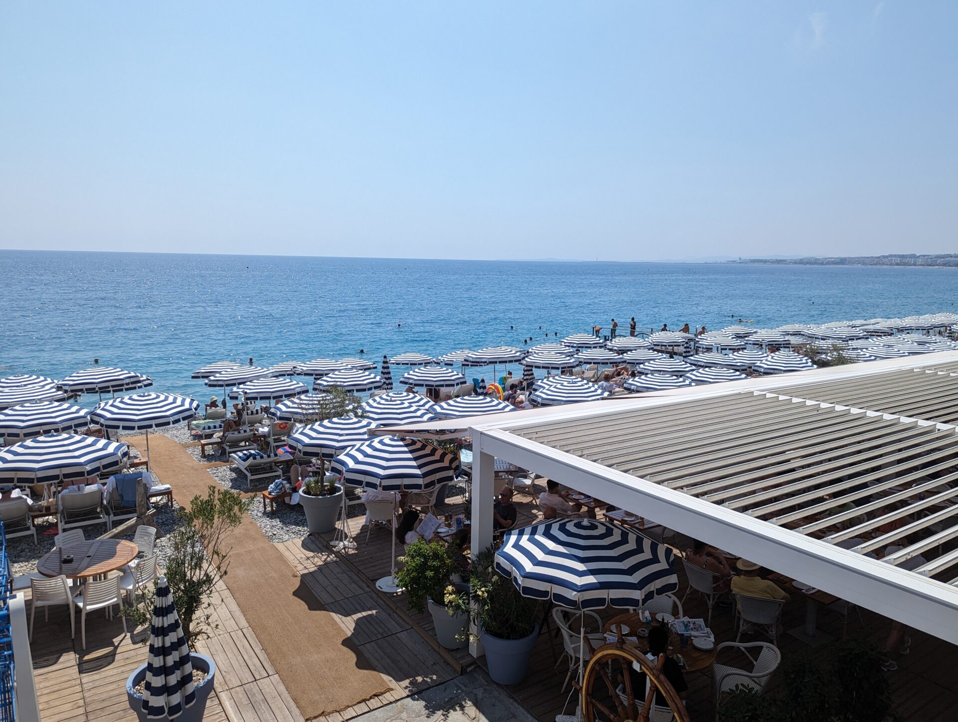 a beach with umbrellas and chairs