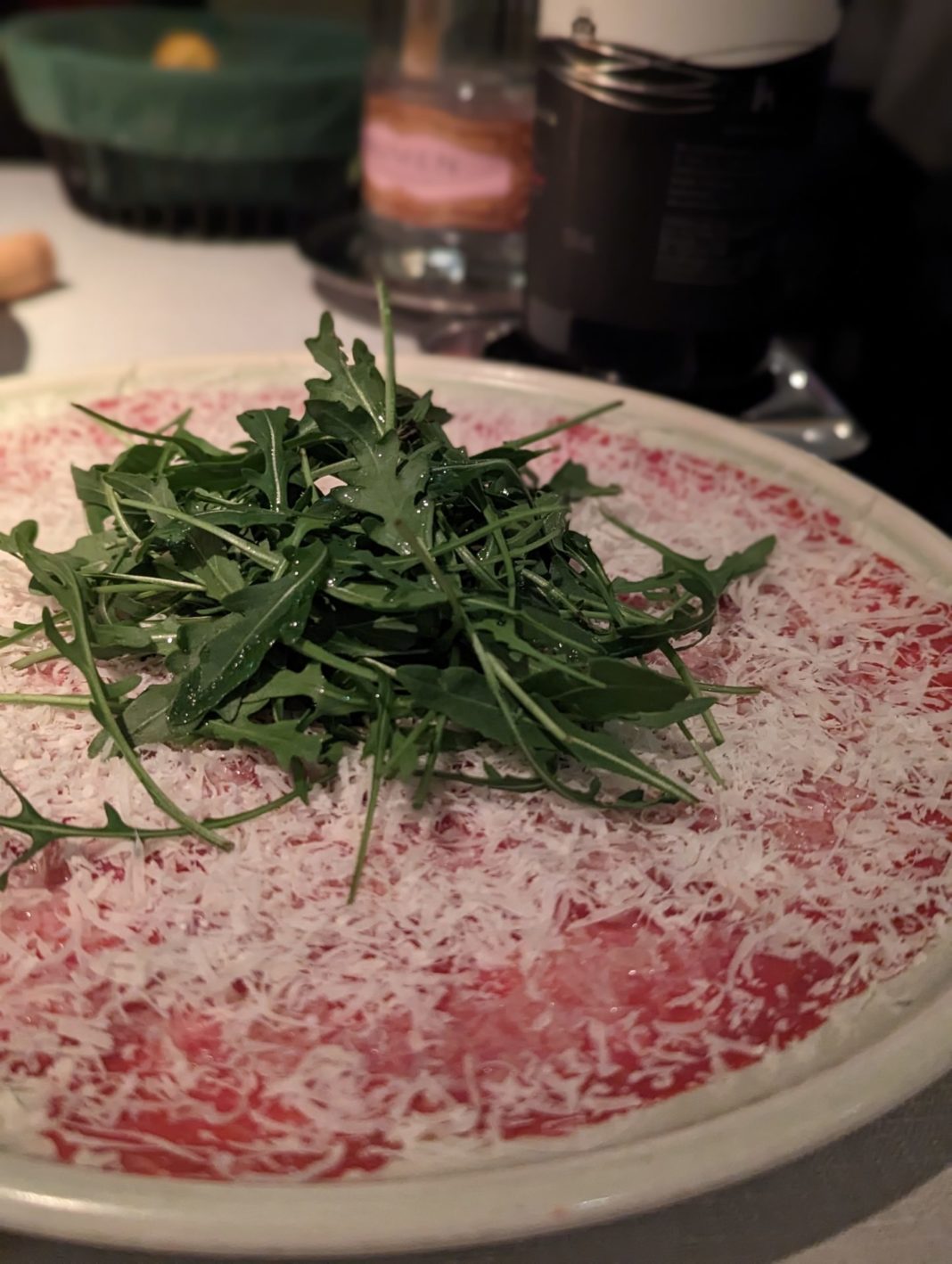 a plate of food with greens on it