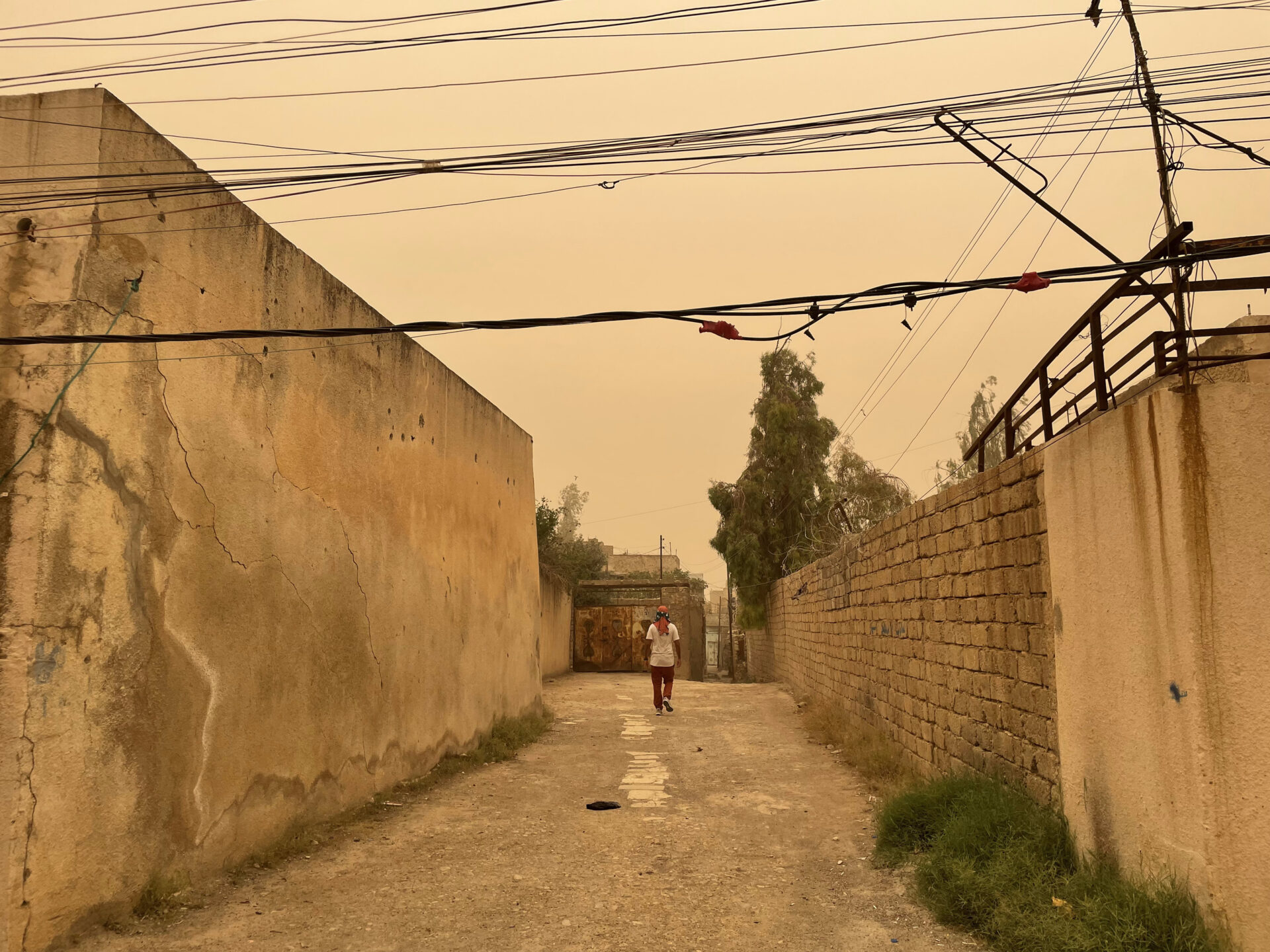 a person walking down a dirt road