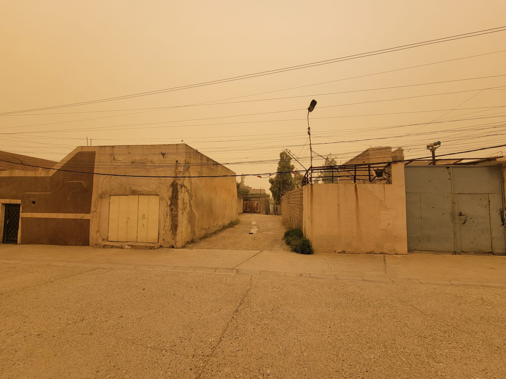 a street with buildings and power lines