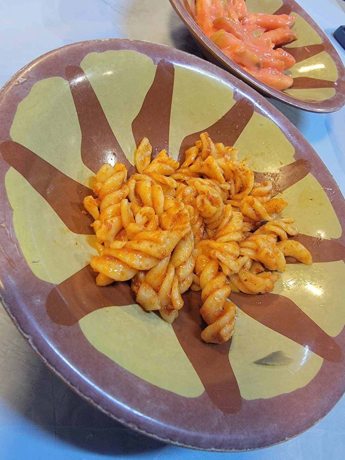 a plate of pasta with sauce on it