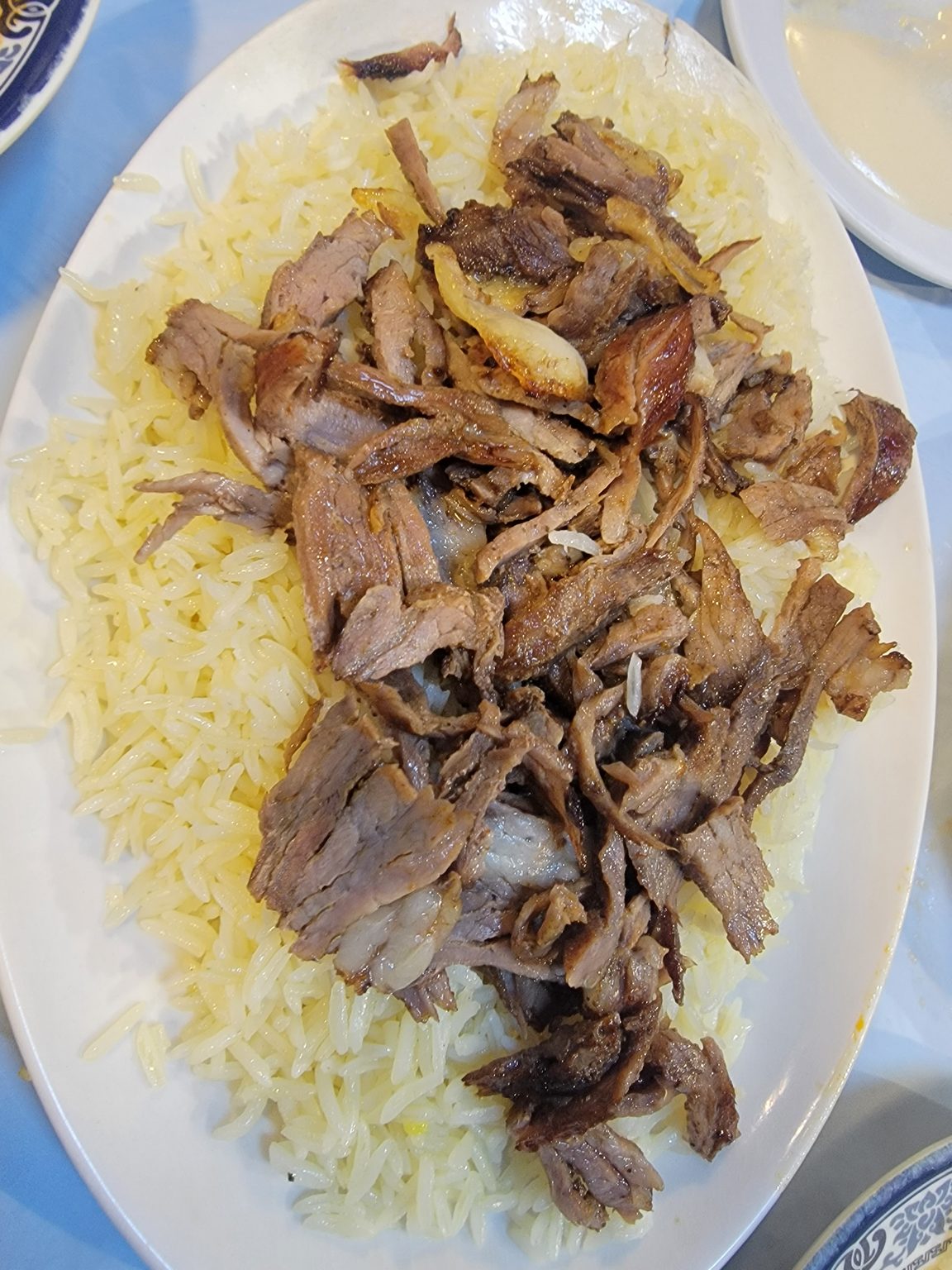 a plate of meat and rice