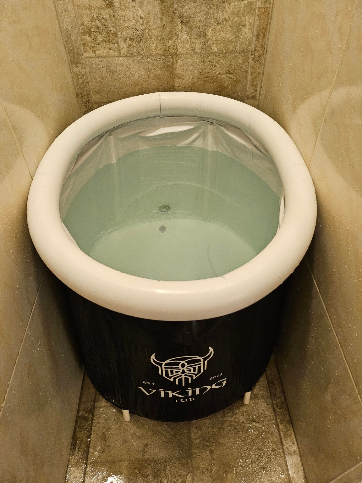 a black and white tub with water inside