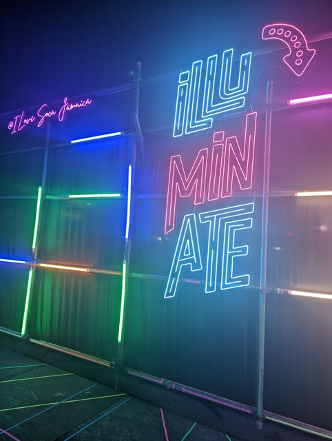 a neon sign on a stage