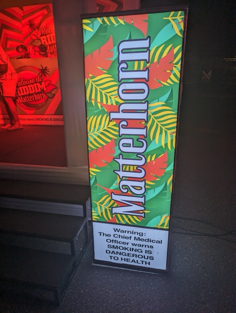 a sign with a leaf pattern on it