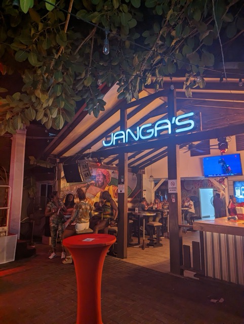 a group of people outside a restaurant