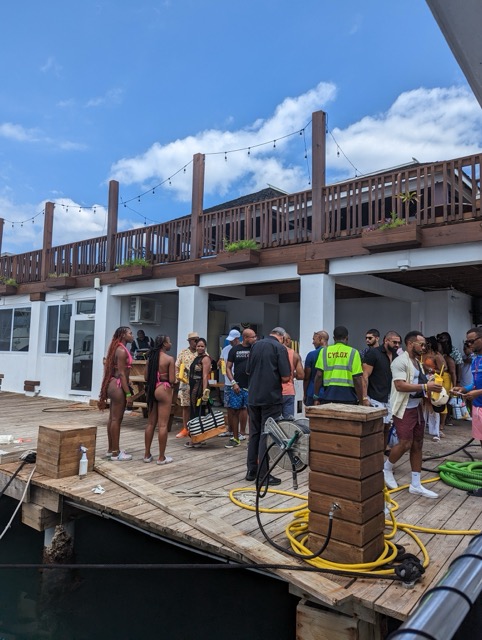 a group of people standing on a dock