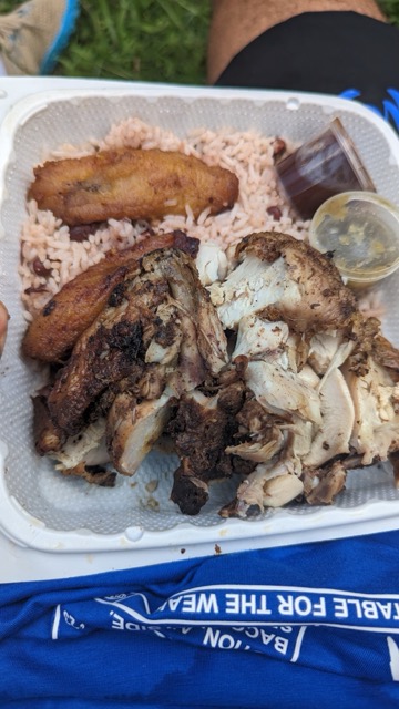 a tray of food with meat and rice