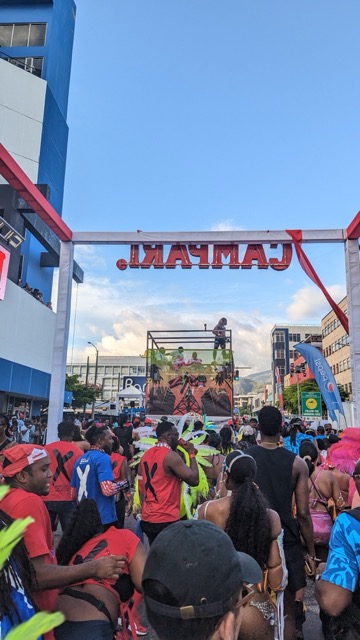 a group of people walking under a stage