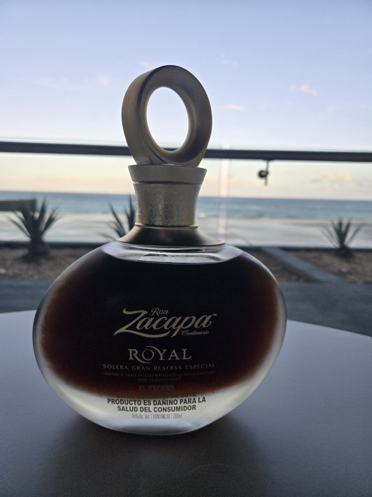 a bottle of liquid on a table