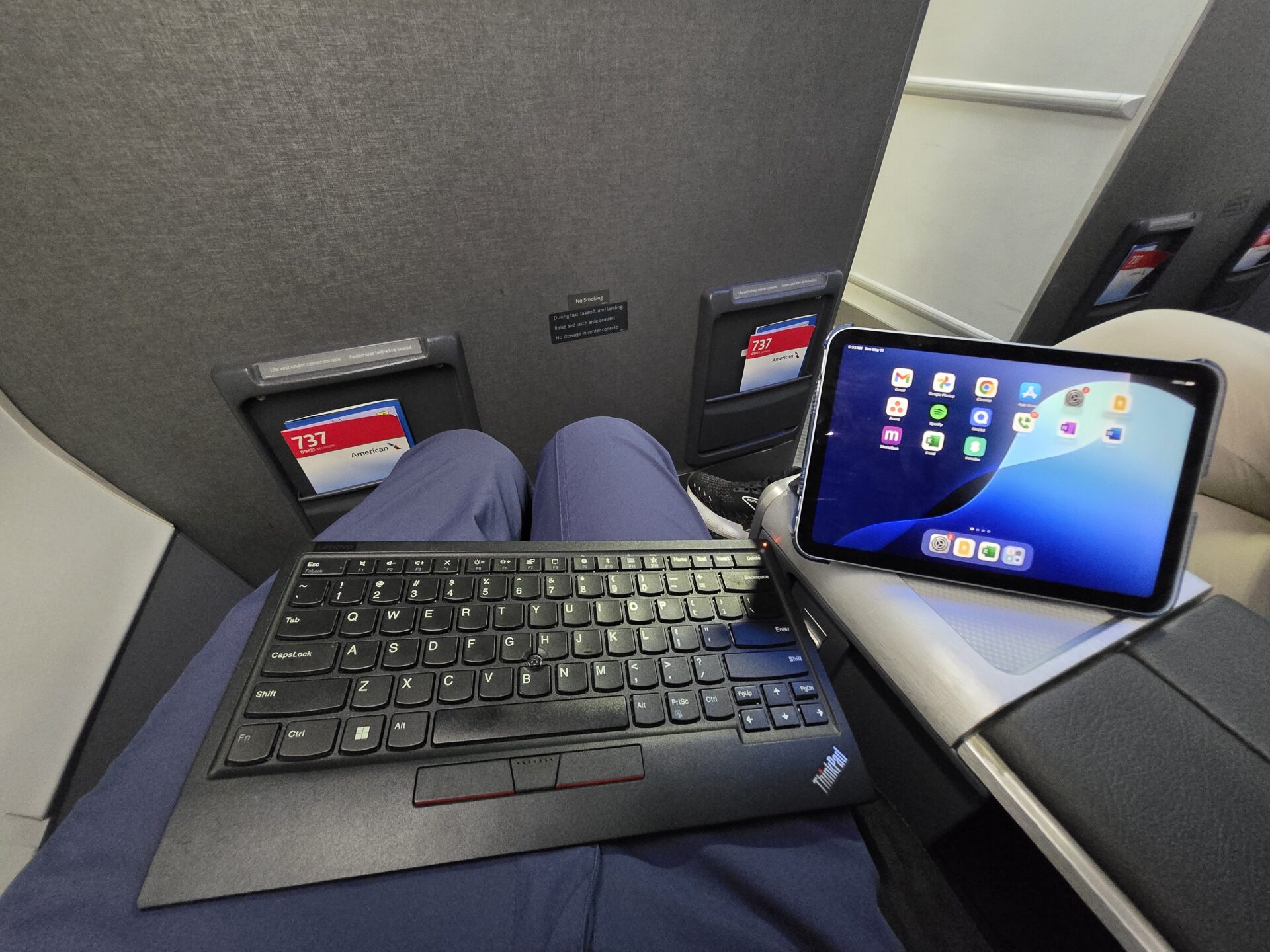 a tablet and keyboard on a person's lap