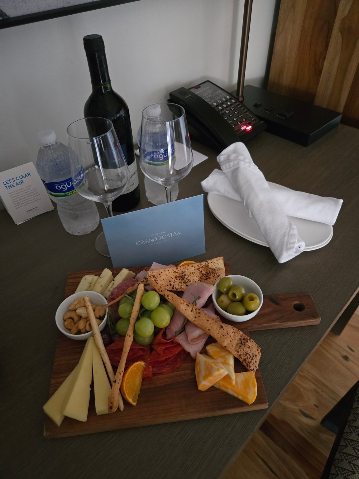 a plate of food and wine glasses on a table