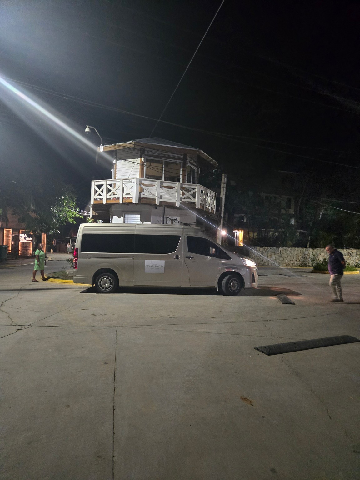 a van parked in a parking lot at night
