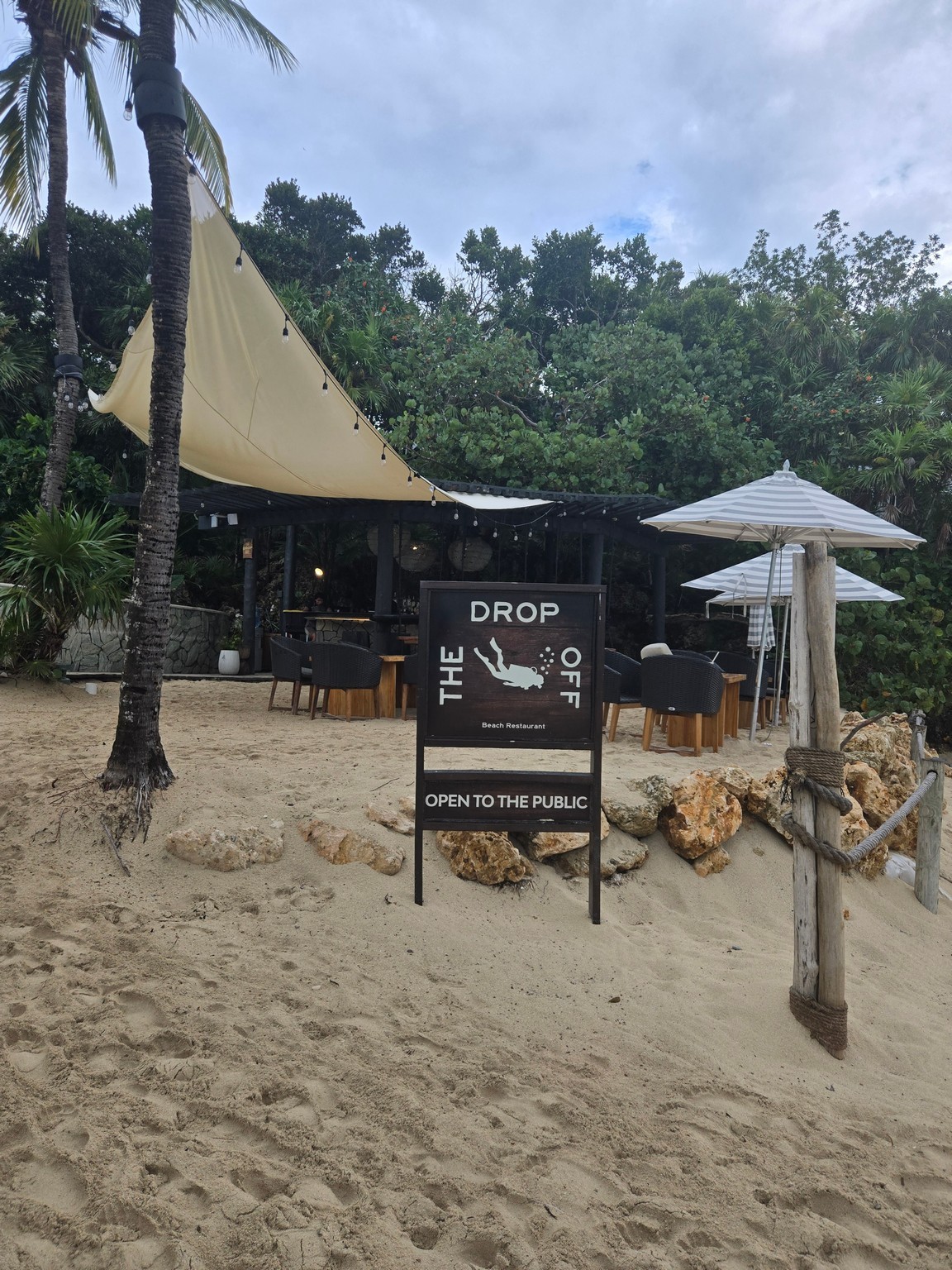 a sign on a beach