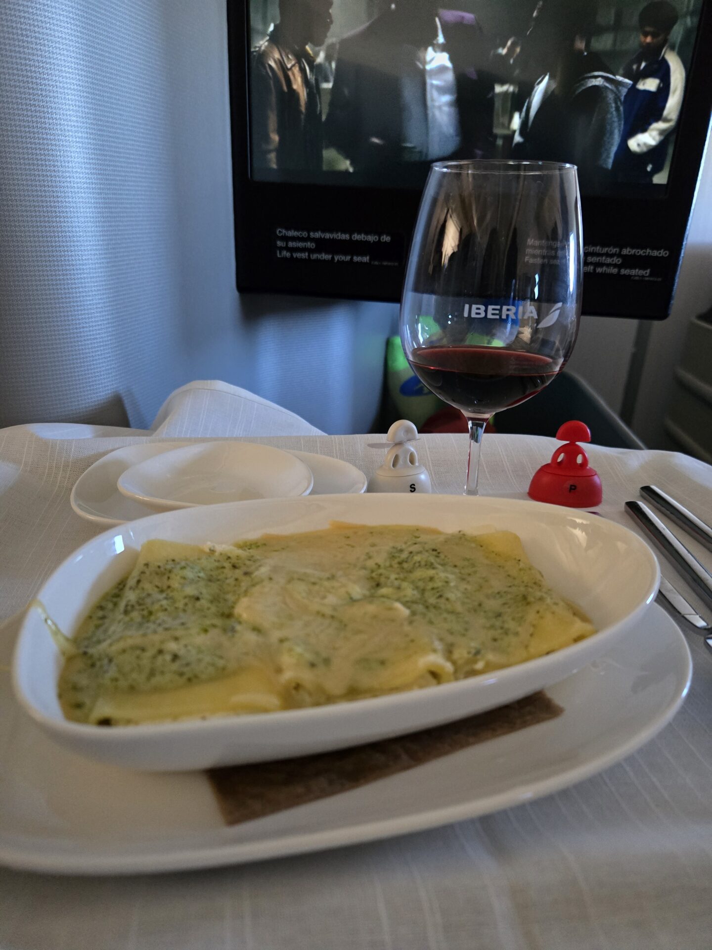 a plate of food and a glass of wine