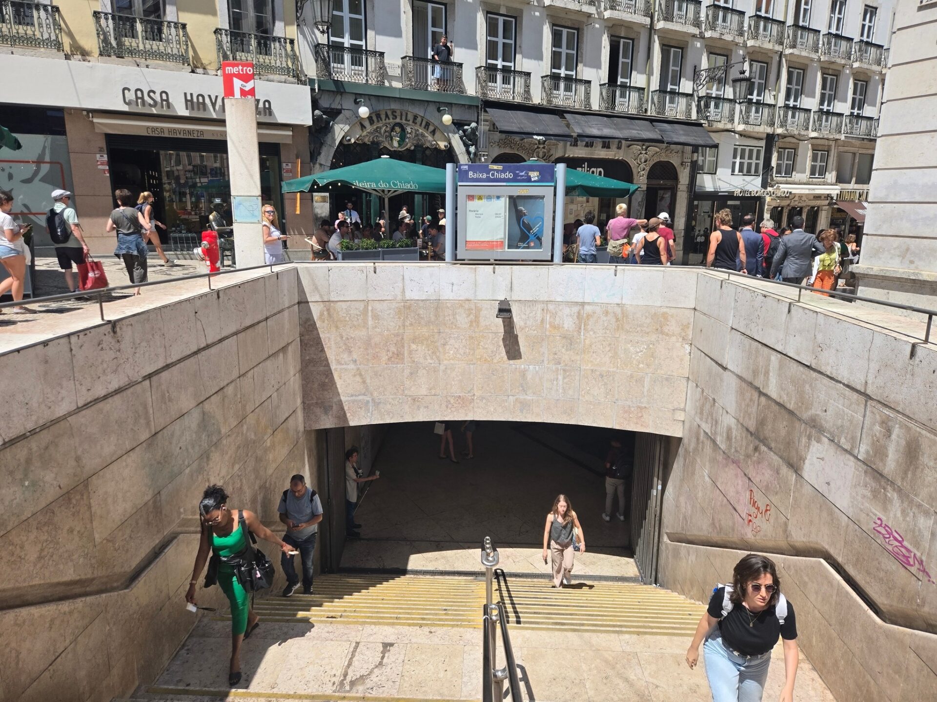 a group of people walking down a tunnel