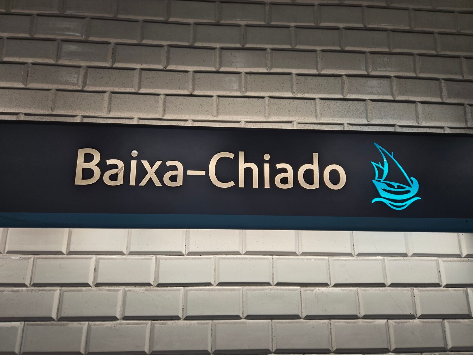 a sign on a brick wall