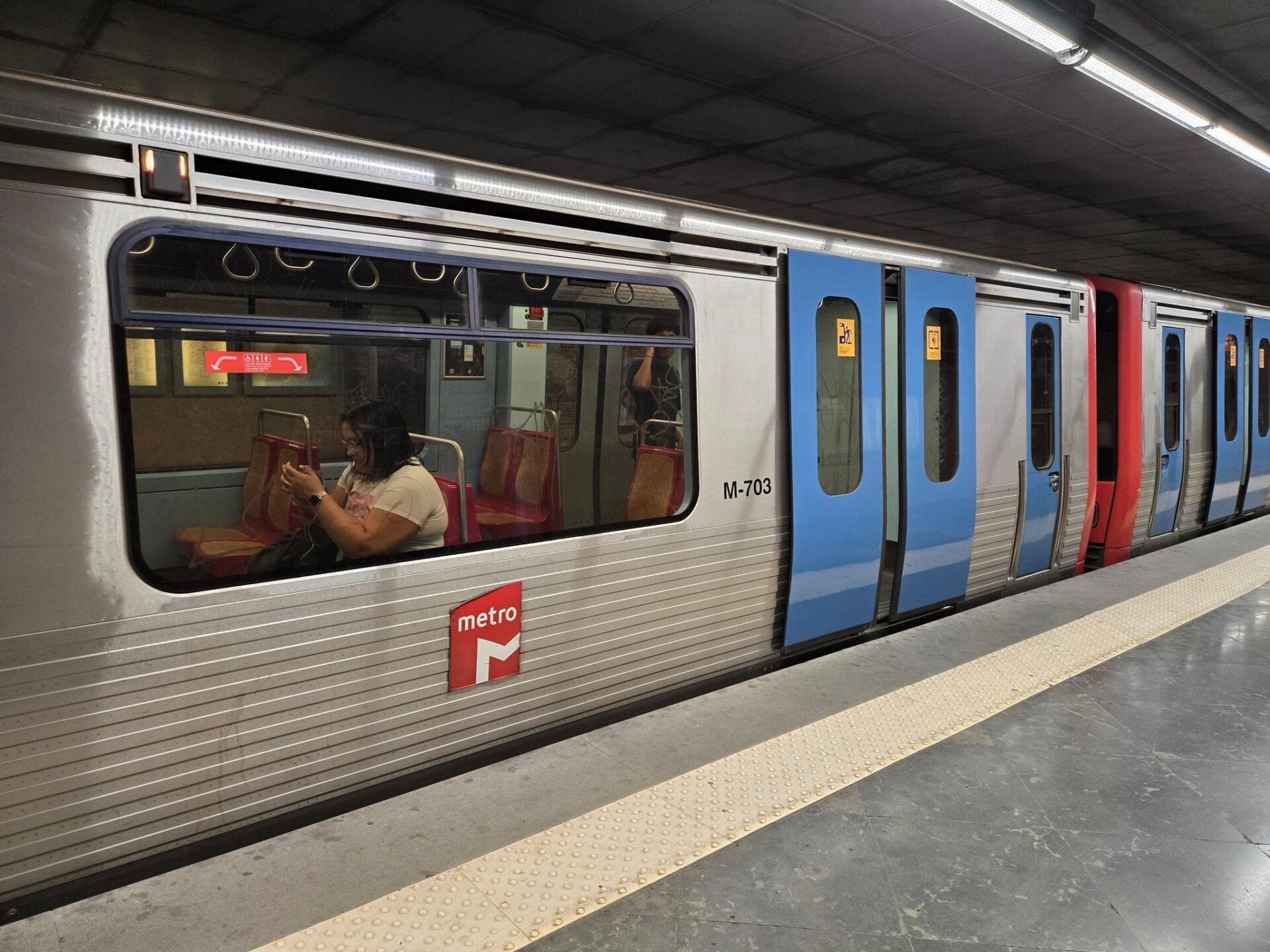 a woman sitting in a train