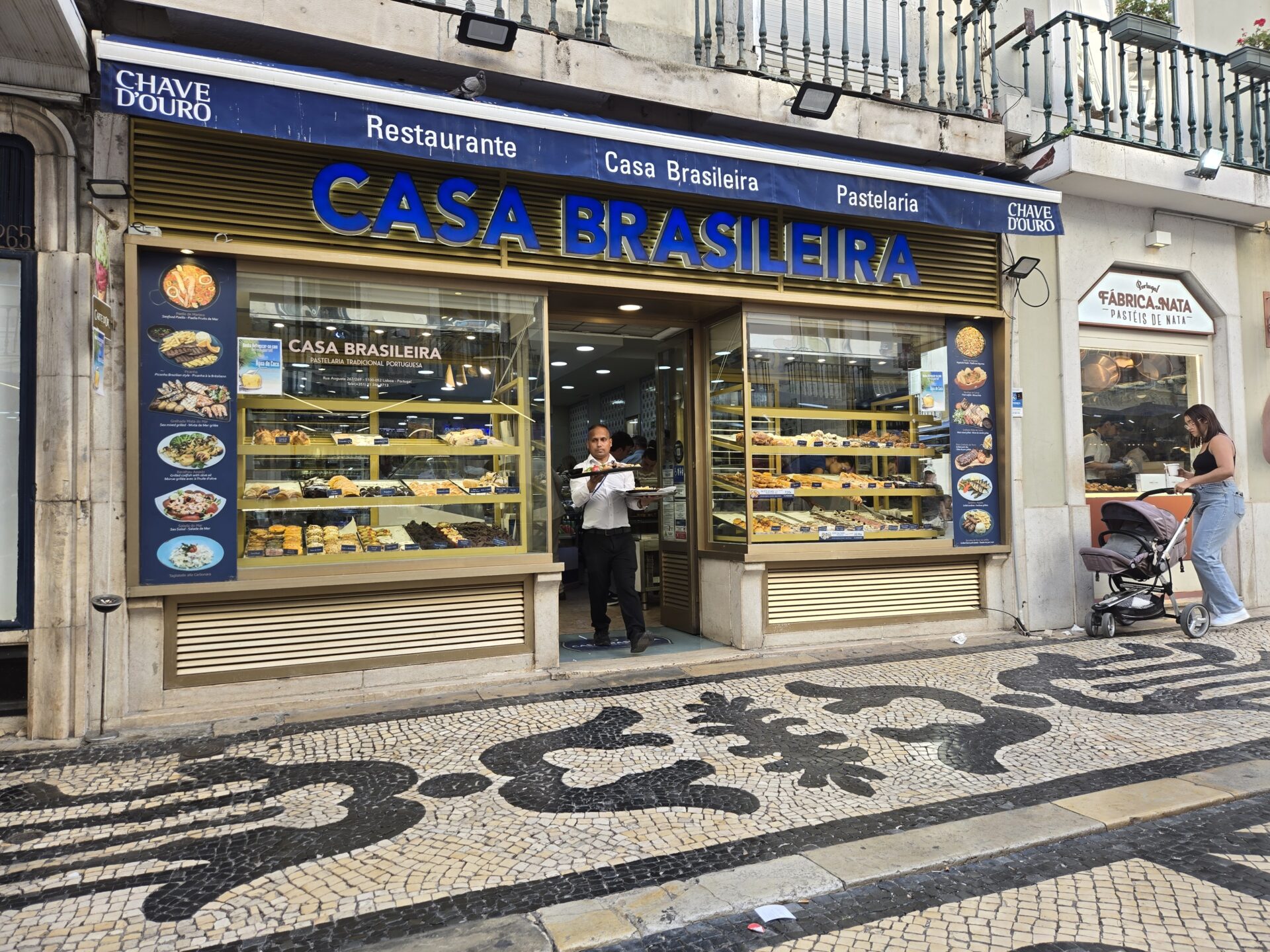 a man standing in front of a bakery