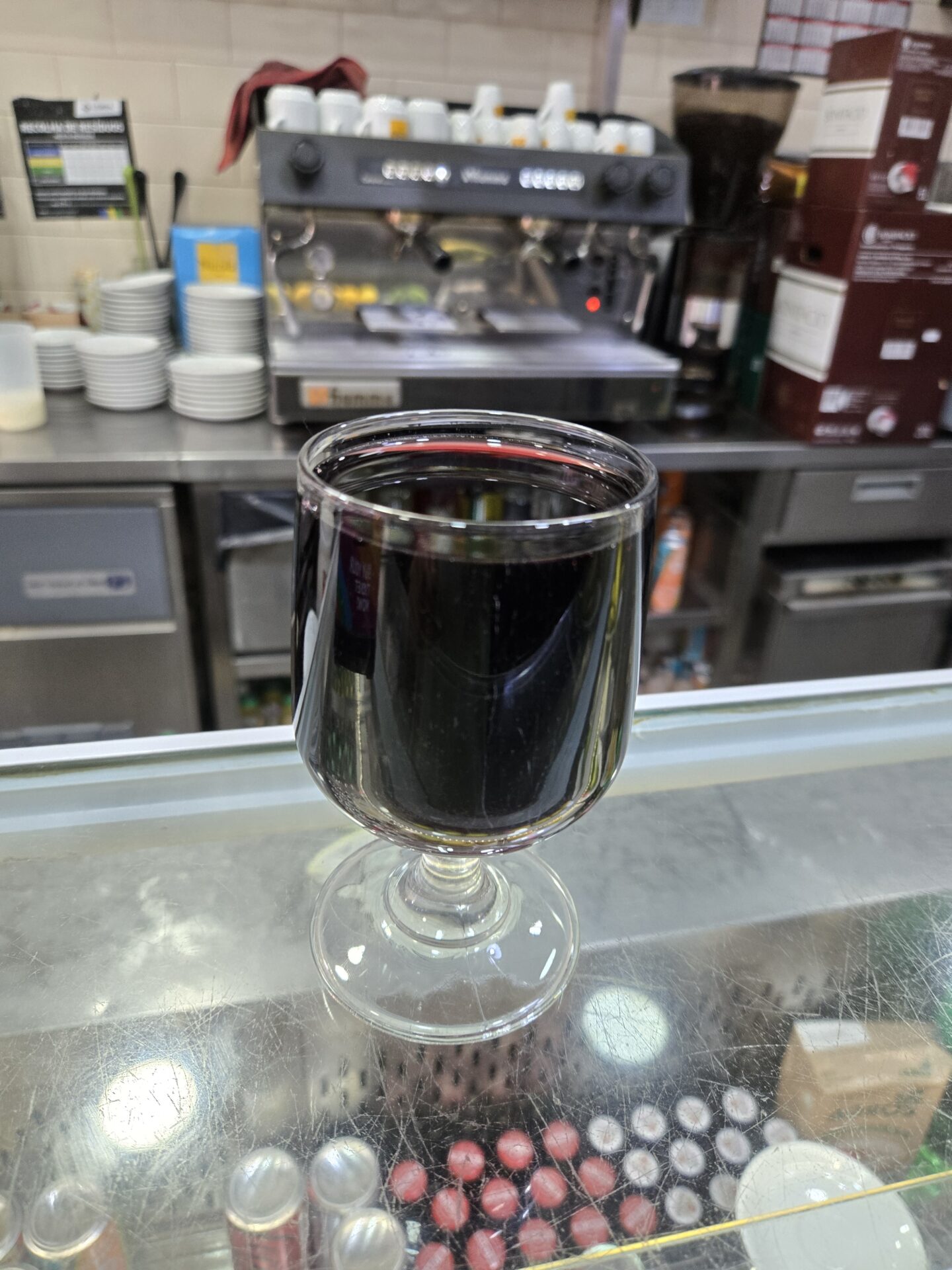 a glass of wine on a counter
